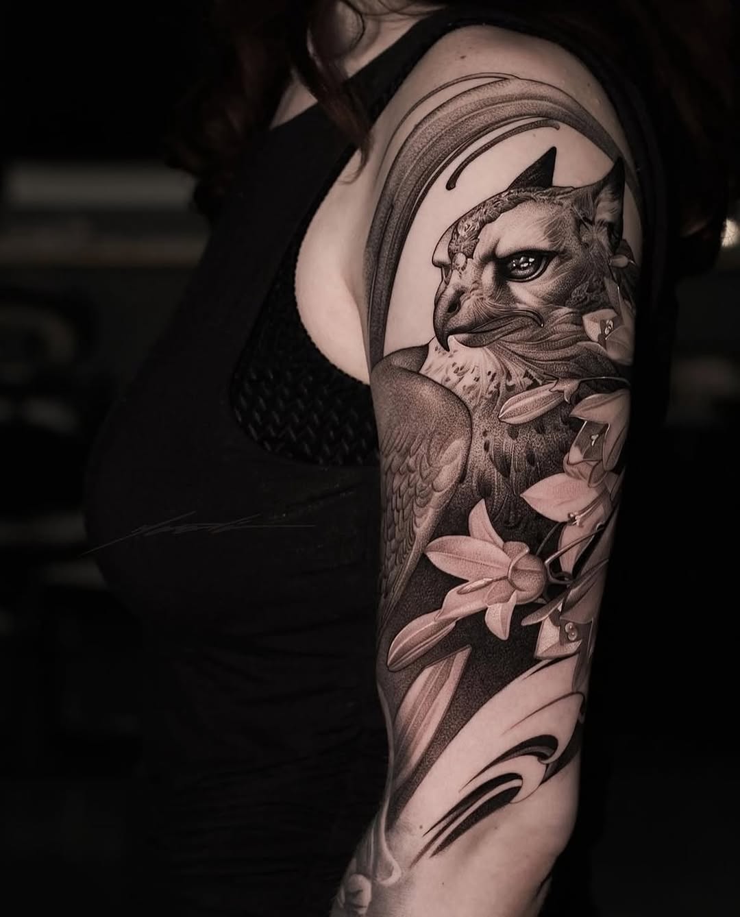 Griffin and flowers realism tattoo on the upper arm by Ke$la