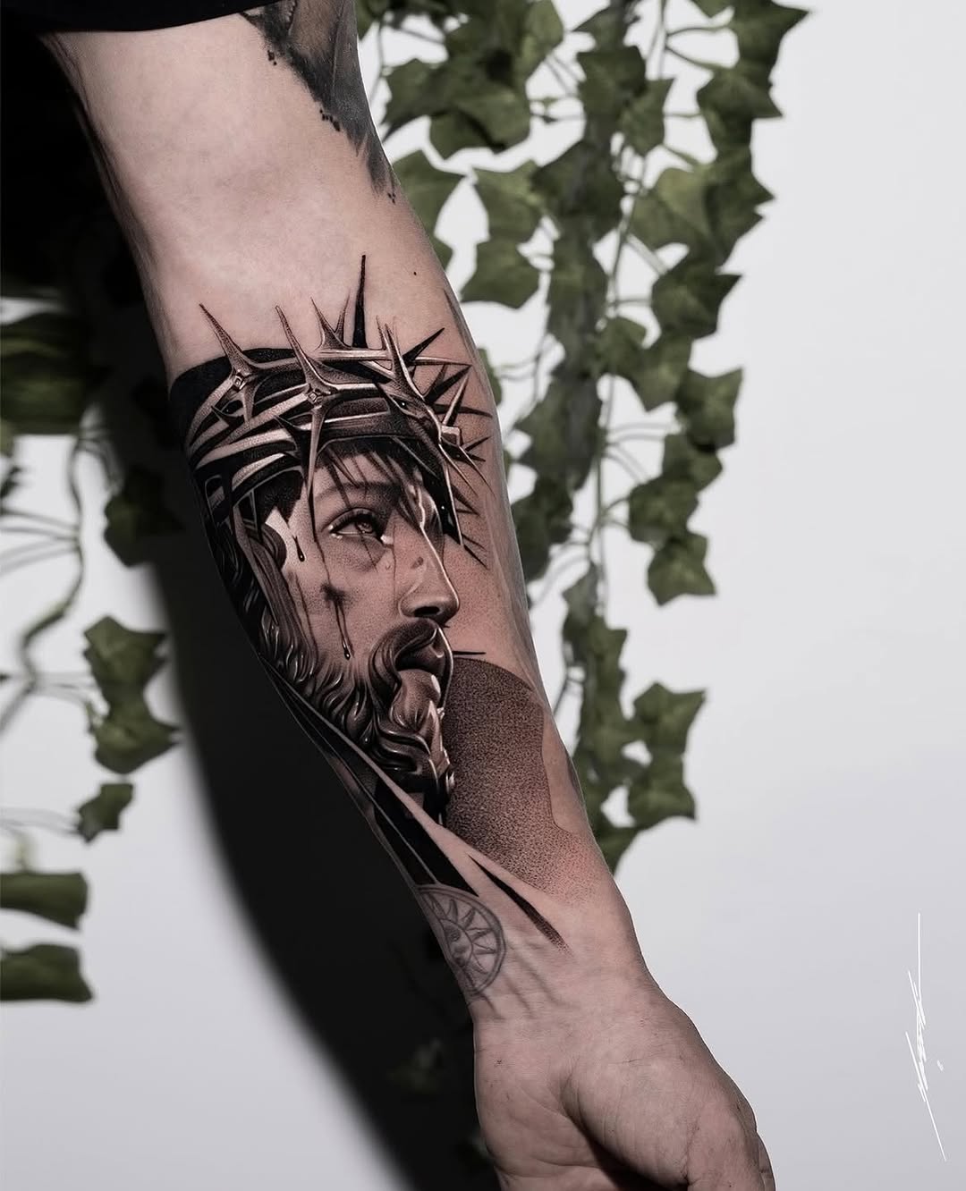 Jesus Christ with crown of thorns Chicano tattoo on the forearm by Ke$la
