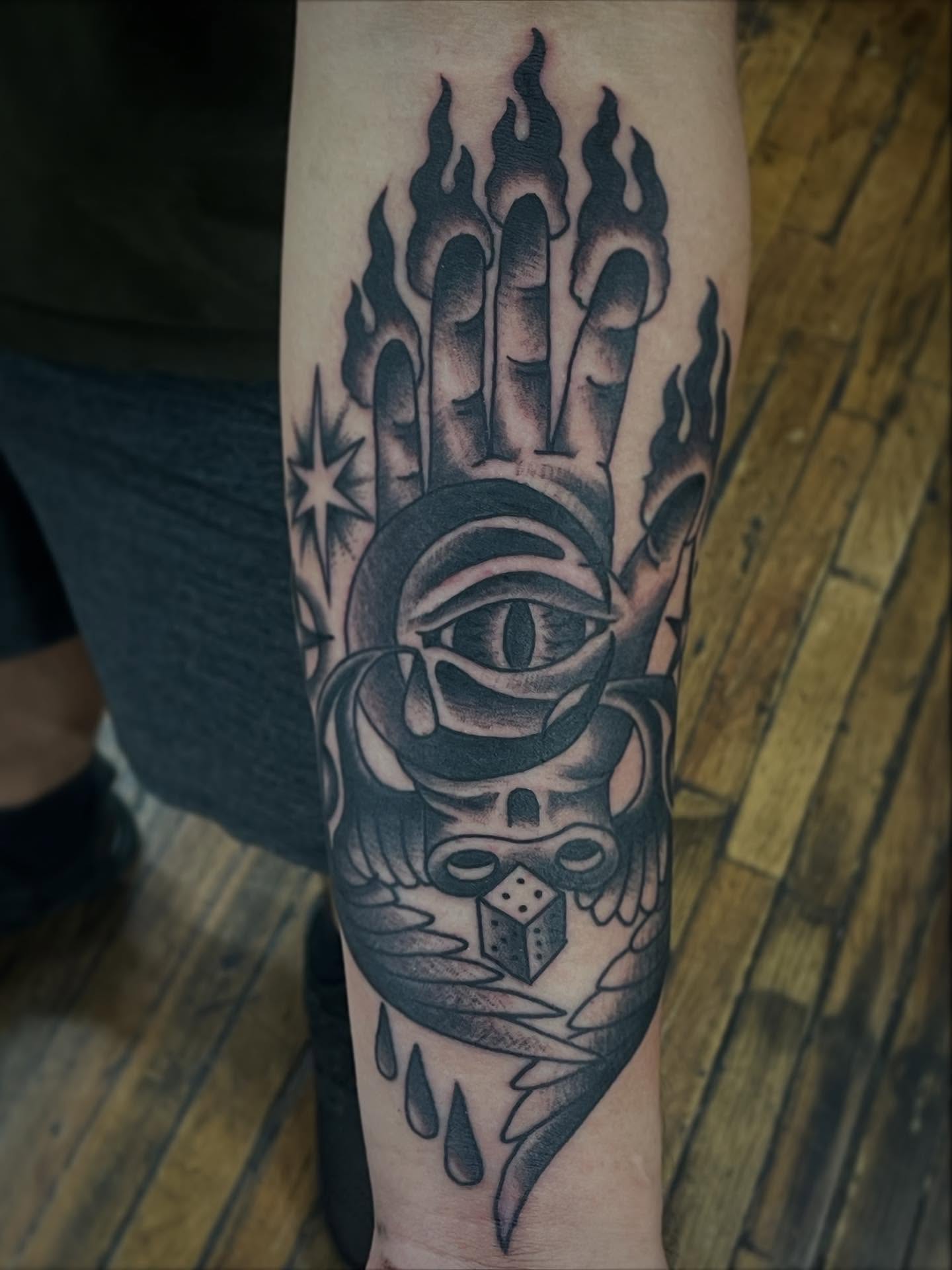 Flaming hand with eye neo-traditional tattoo on the forearm by Haley McMahon
