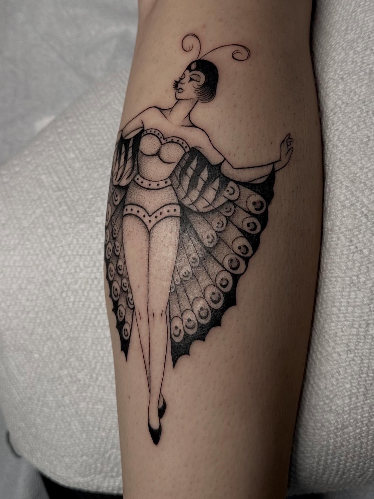 Peacock-inspired woman illustrative tattoo on the forearm by Lia Massari