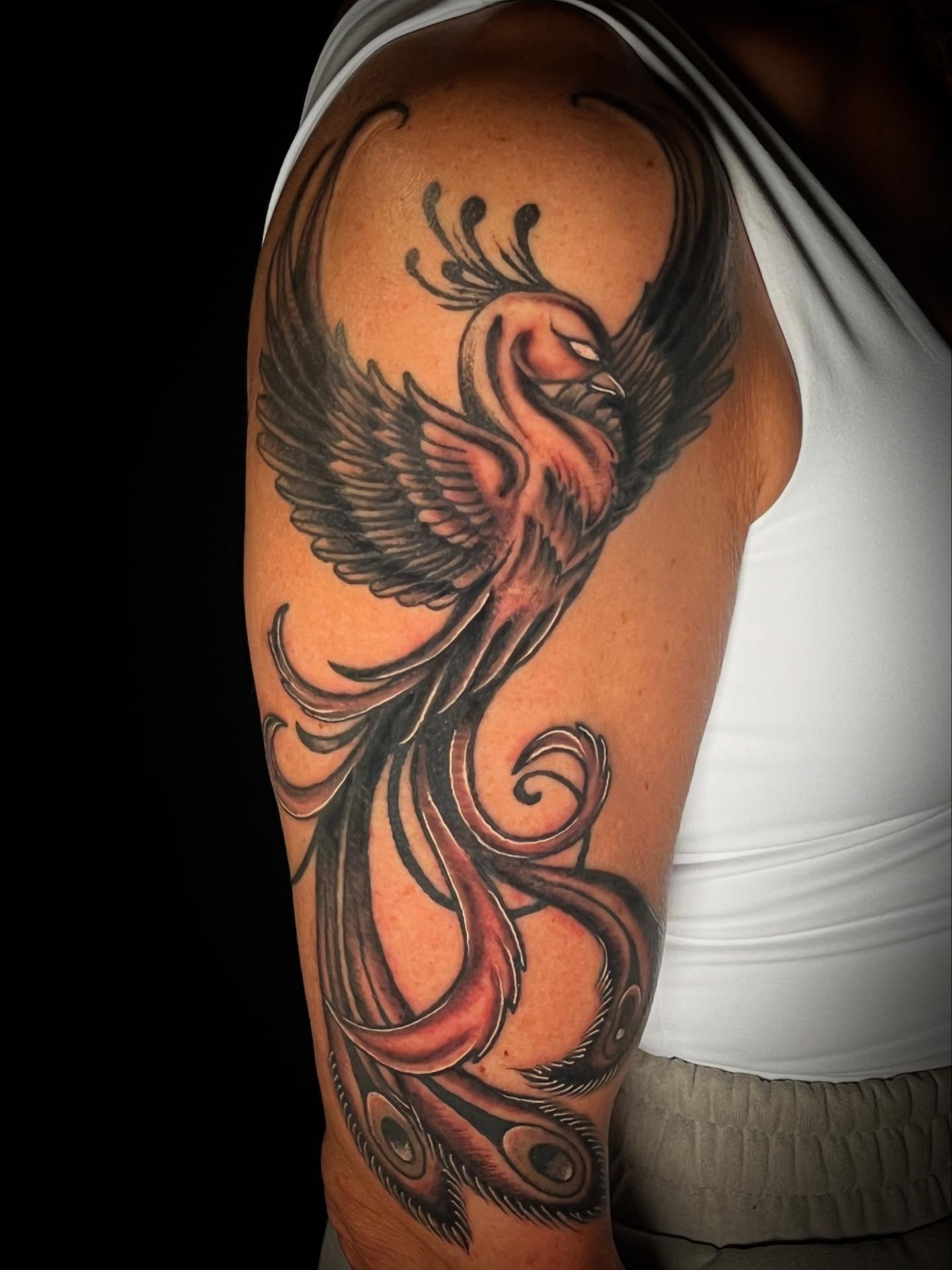 Phoenix neo-traditional tattoo on the shoulder by Suzanne B