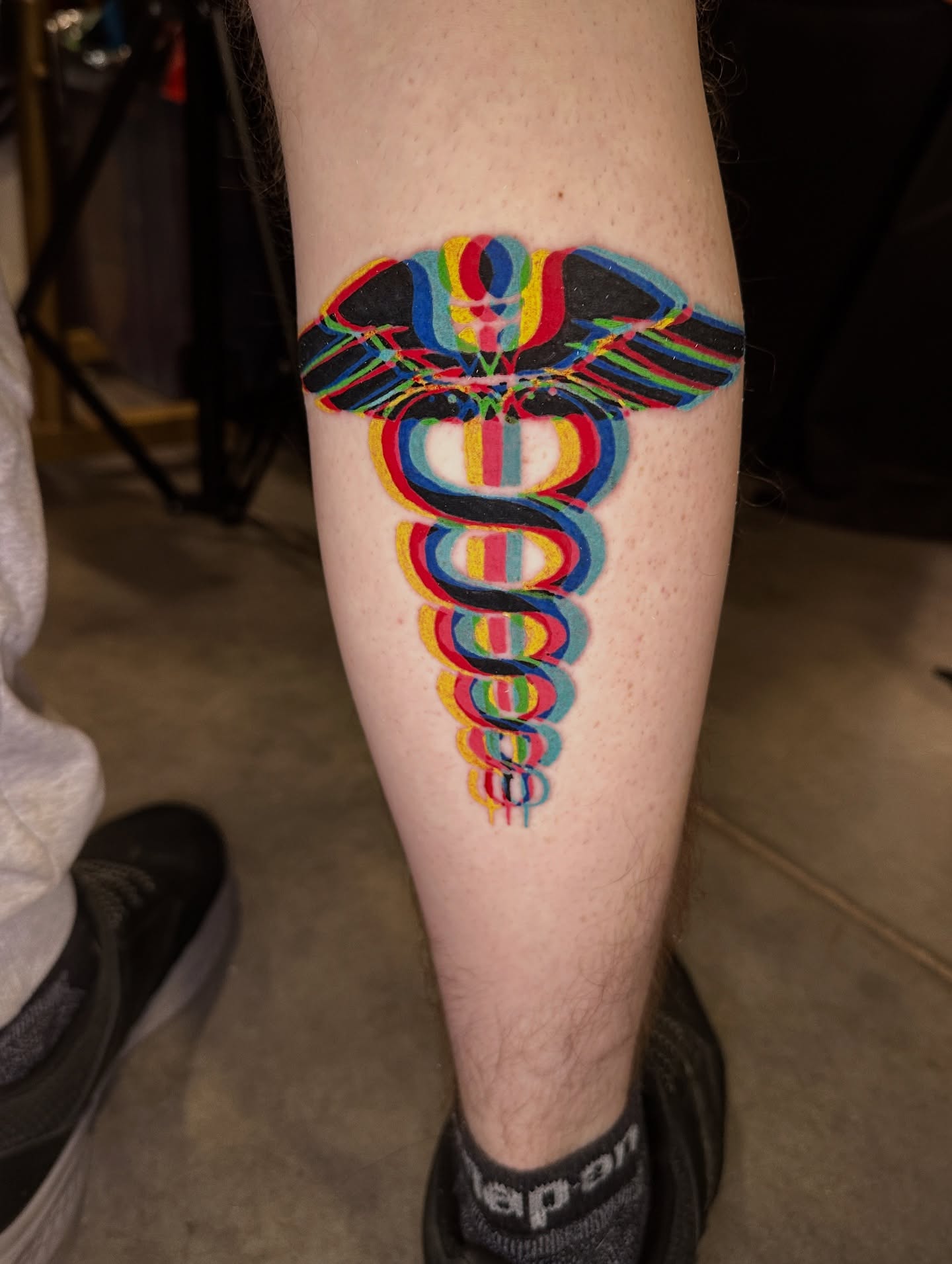Caduceus new school tattoo on the forearm by Nashville Tattoo Artist - Nicolette Madlyne