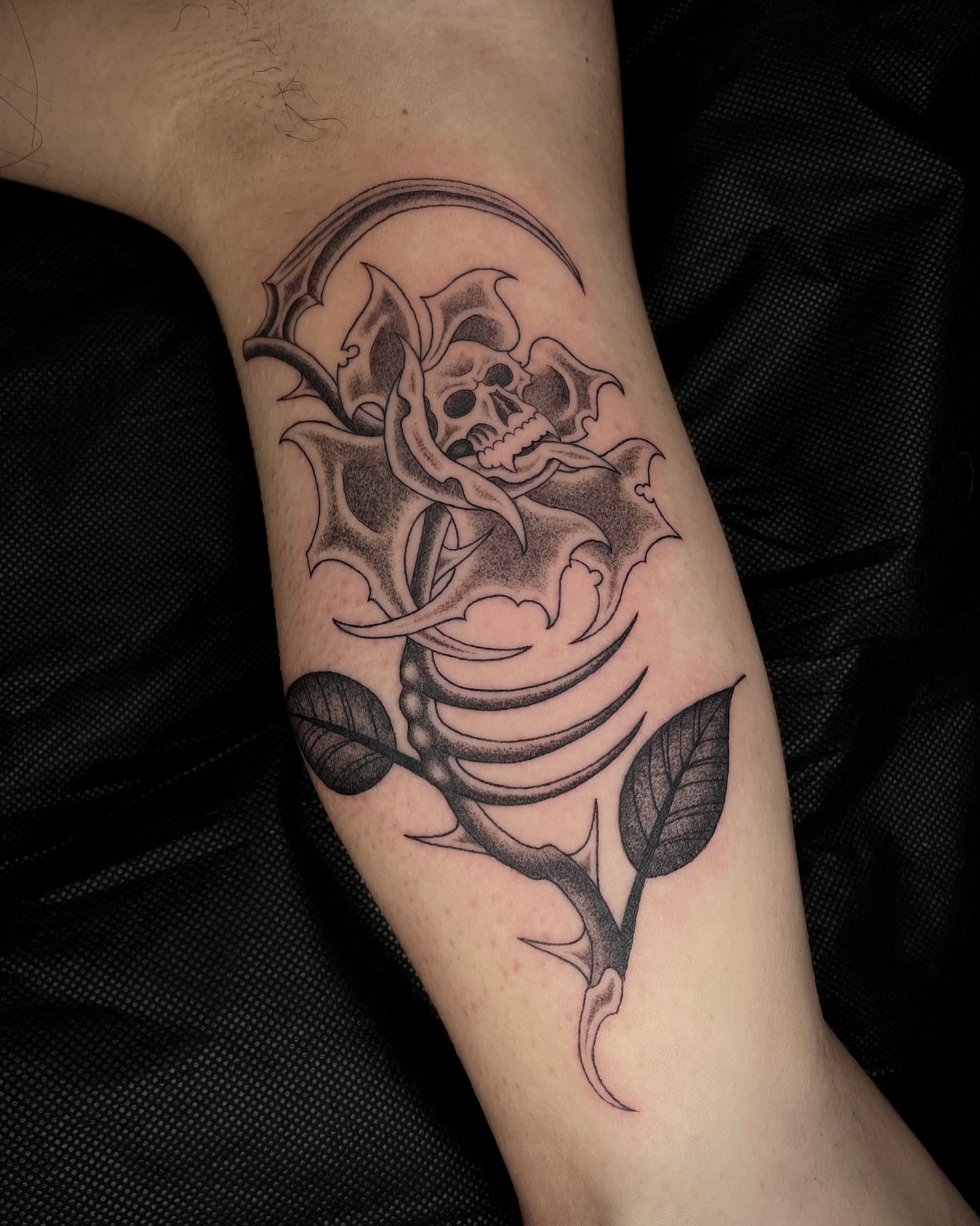 Rose with skull realism tattoo on the forearm by Tattoo Artist, in San Francisco, CA