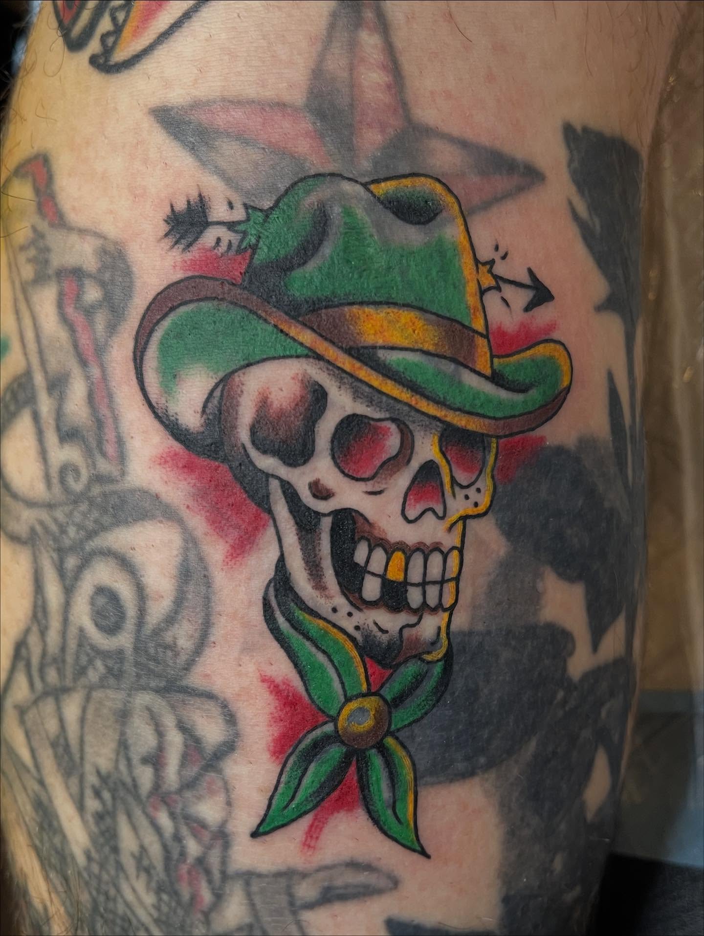 Skull wearing hat American traditional tattoo on the forearm by Josh Brownell