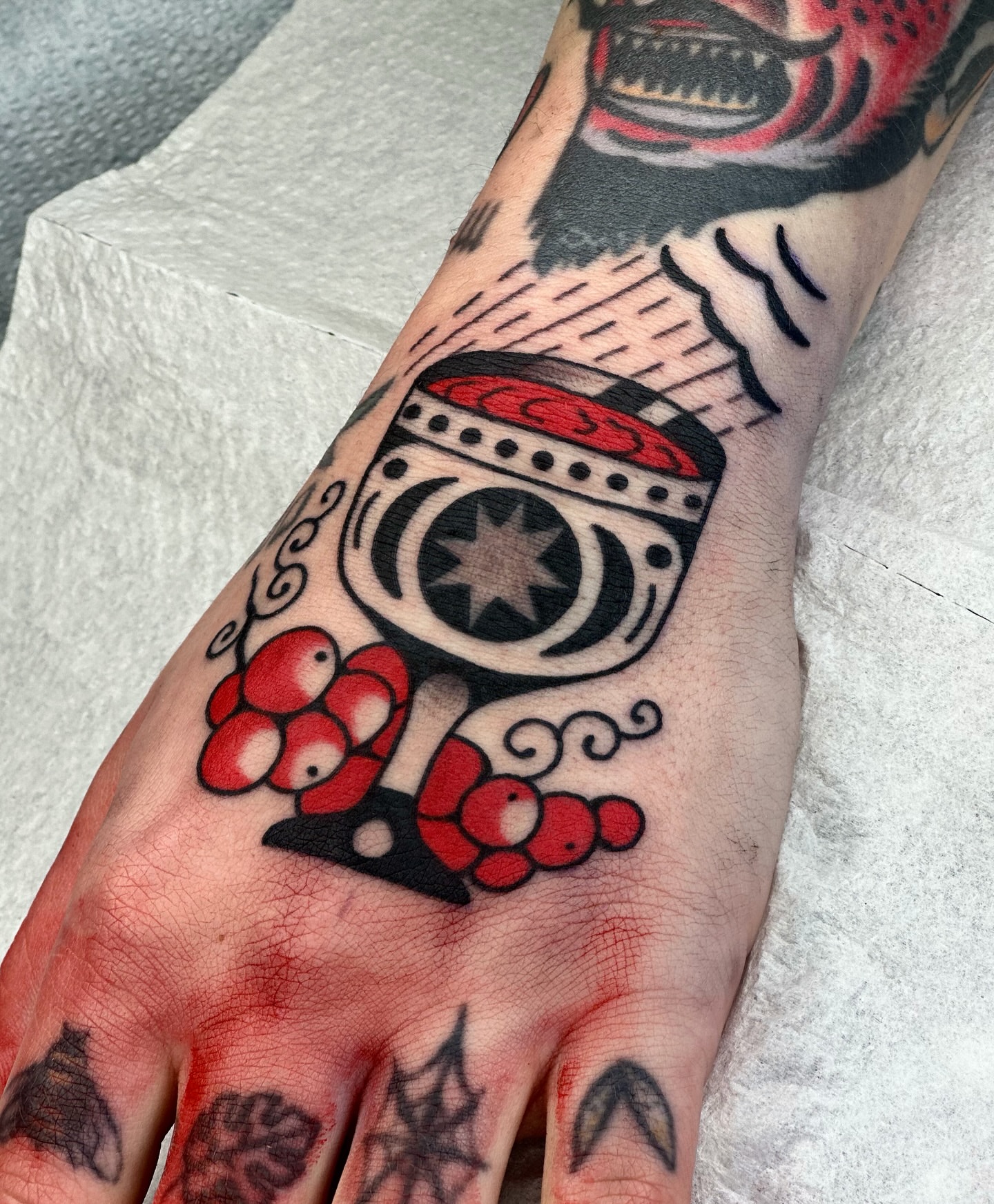 Space helmet American traditional tattoo on the hand by Maks