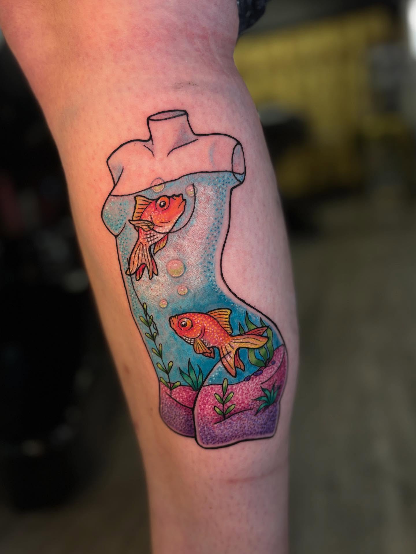 Goldfish in a bottle new school tattoo on the thigh by Tattoos by Gina Palladino