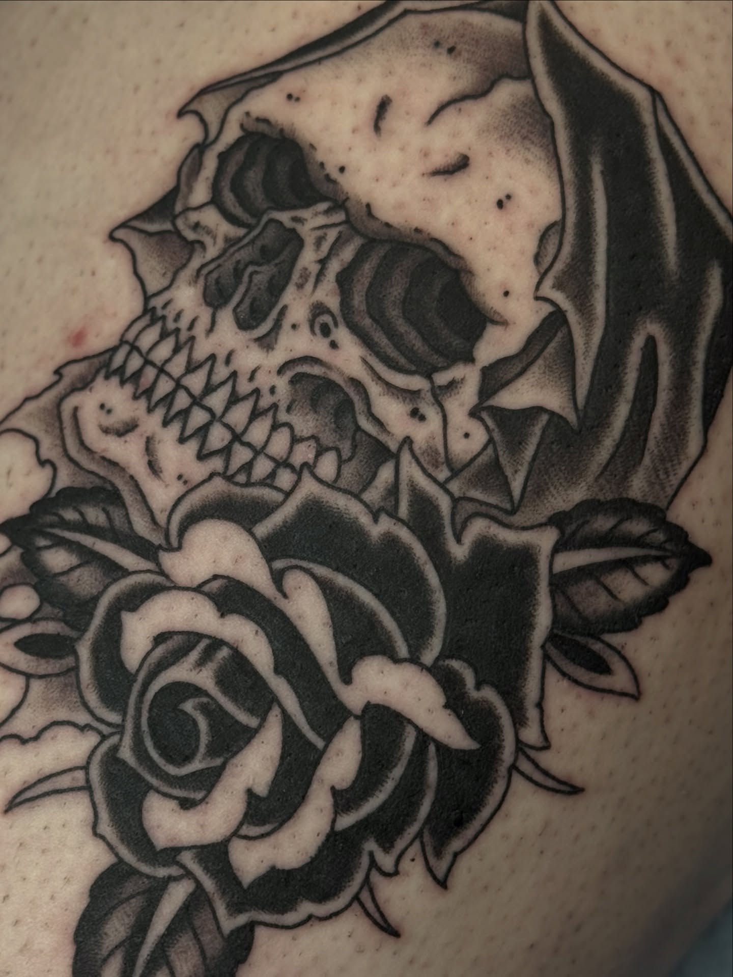 Skull and roses realism tattoo on the shoulder by Christopher  Cousins, Nashville, Tennessee