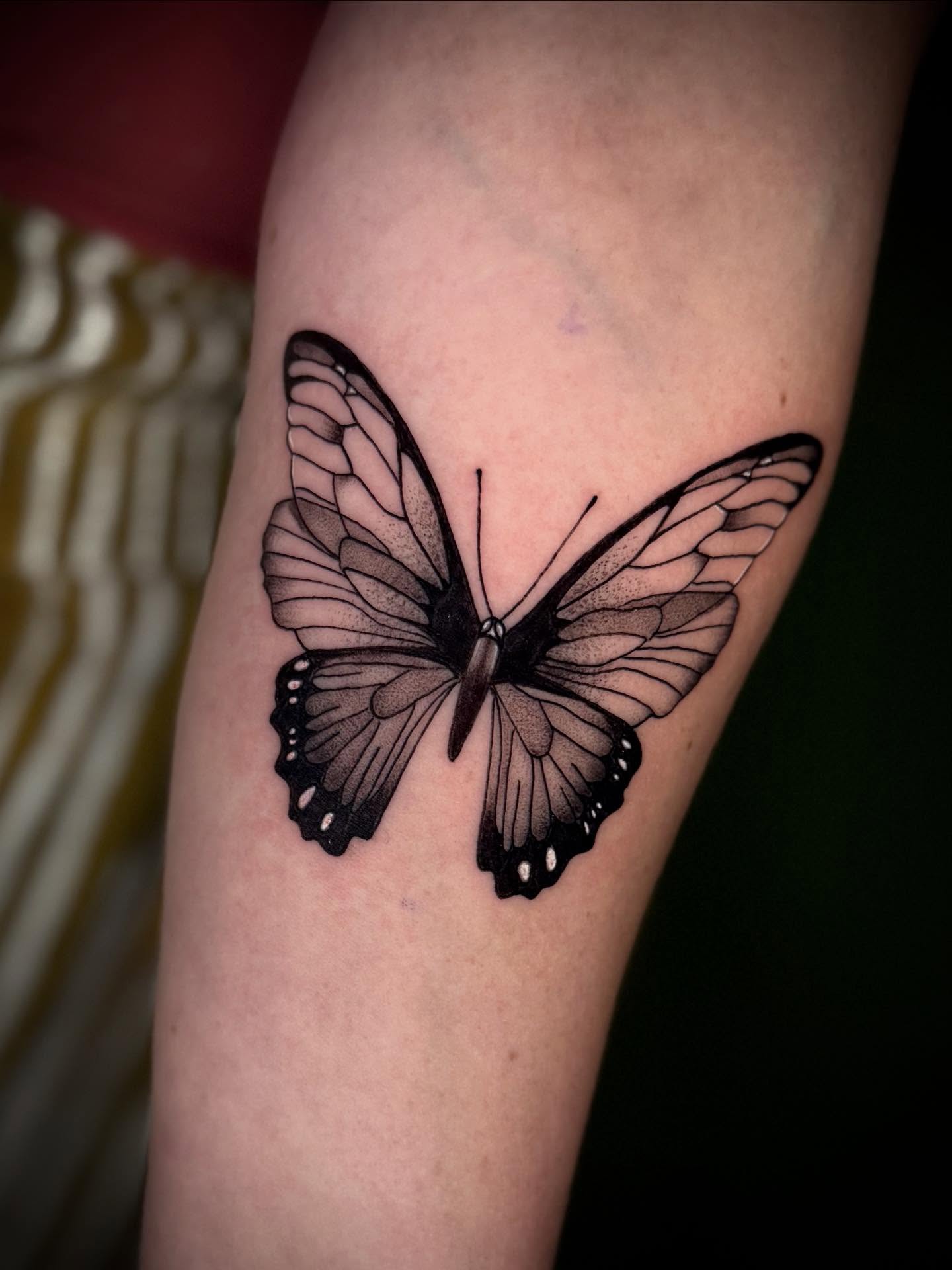 Butterfly realism tattoo on the forearm by Terence Taylor