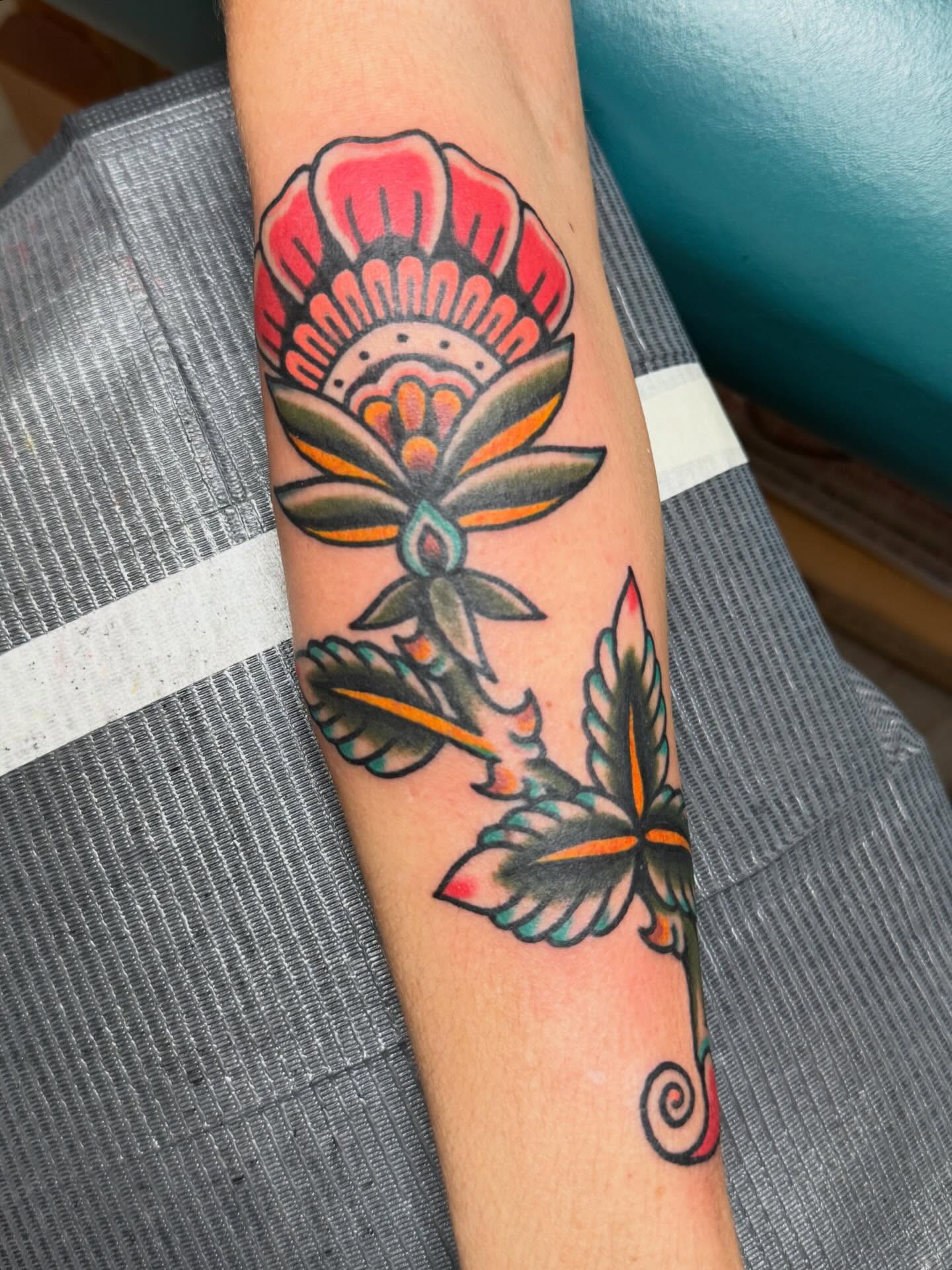 Flower American traditional tattoo on the forearm by Bill Crawford, Plymouth, Michigan
