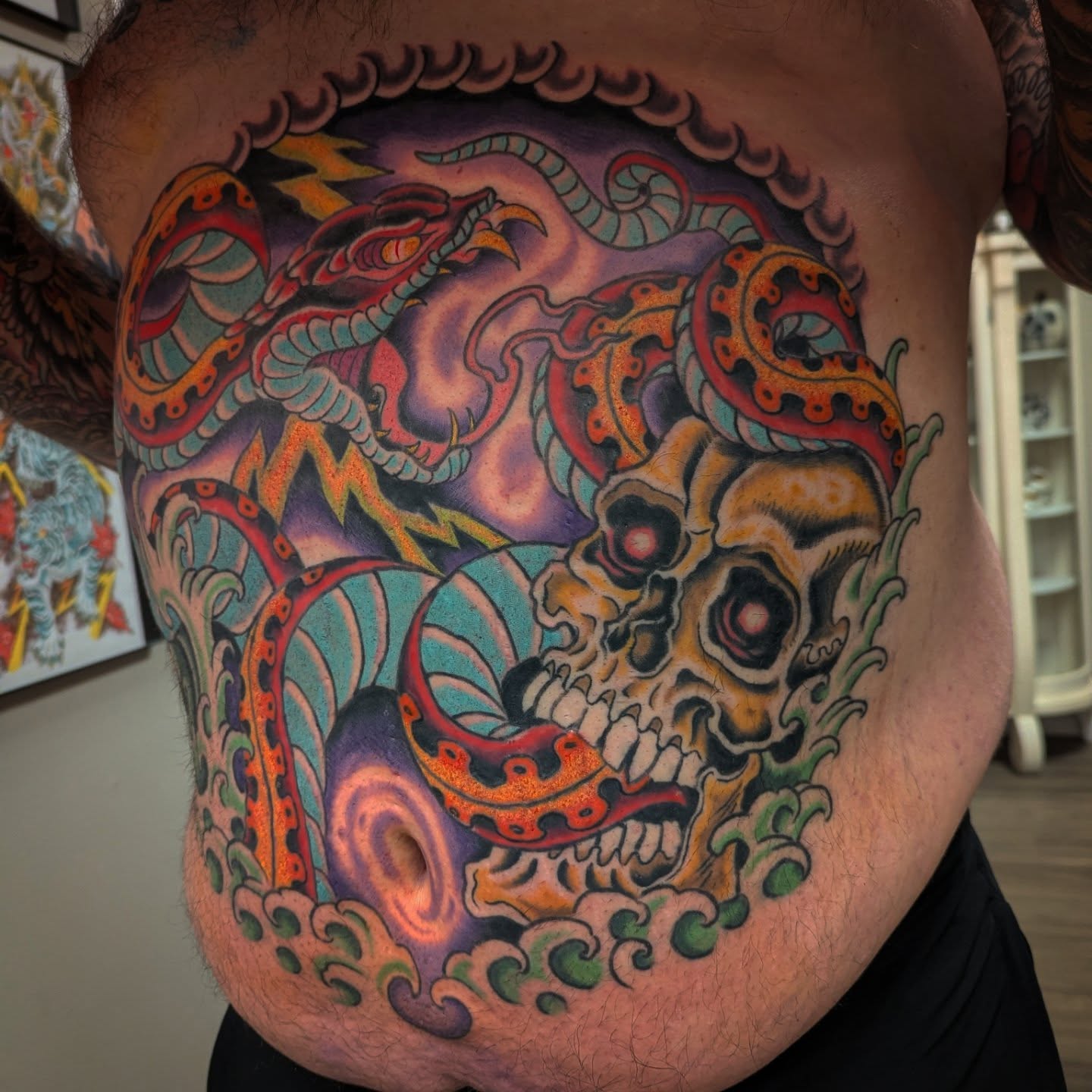 Skull and tentacles japanese irezumi tattoo on the ribs by Ryan Slegel