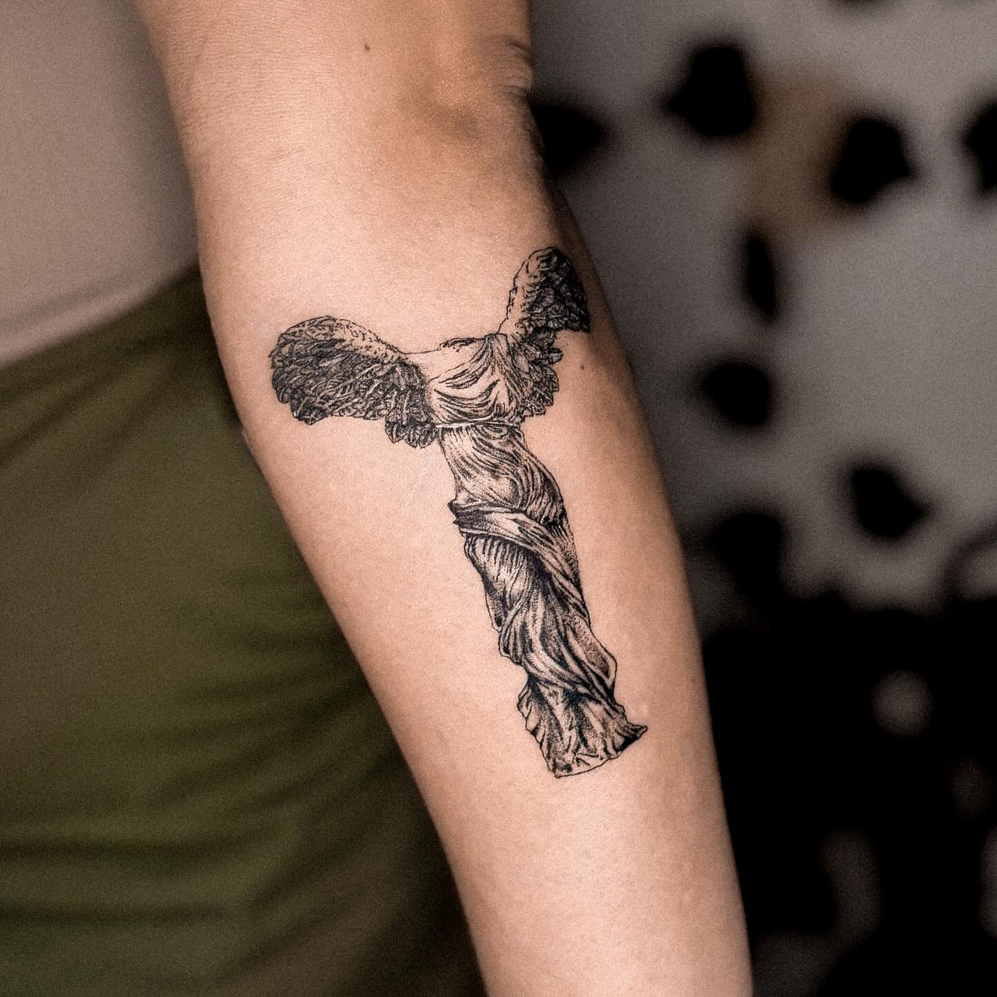 Winged goddess black and grey tattoo on the forearm by 조조