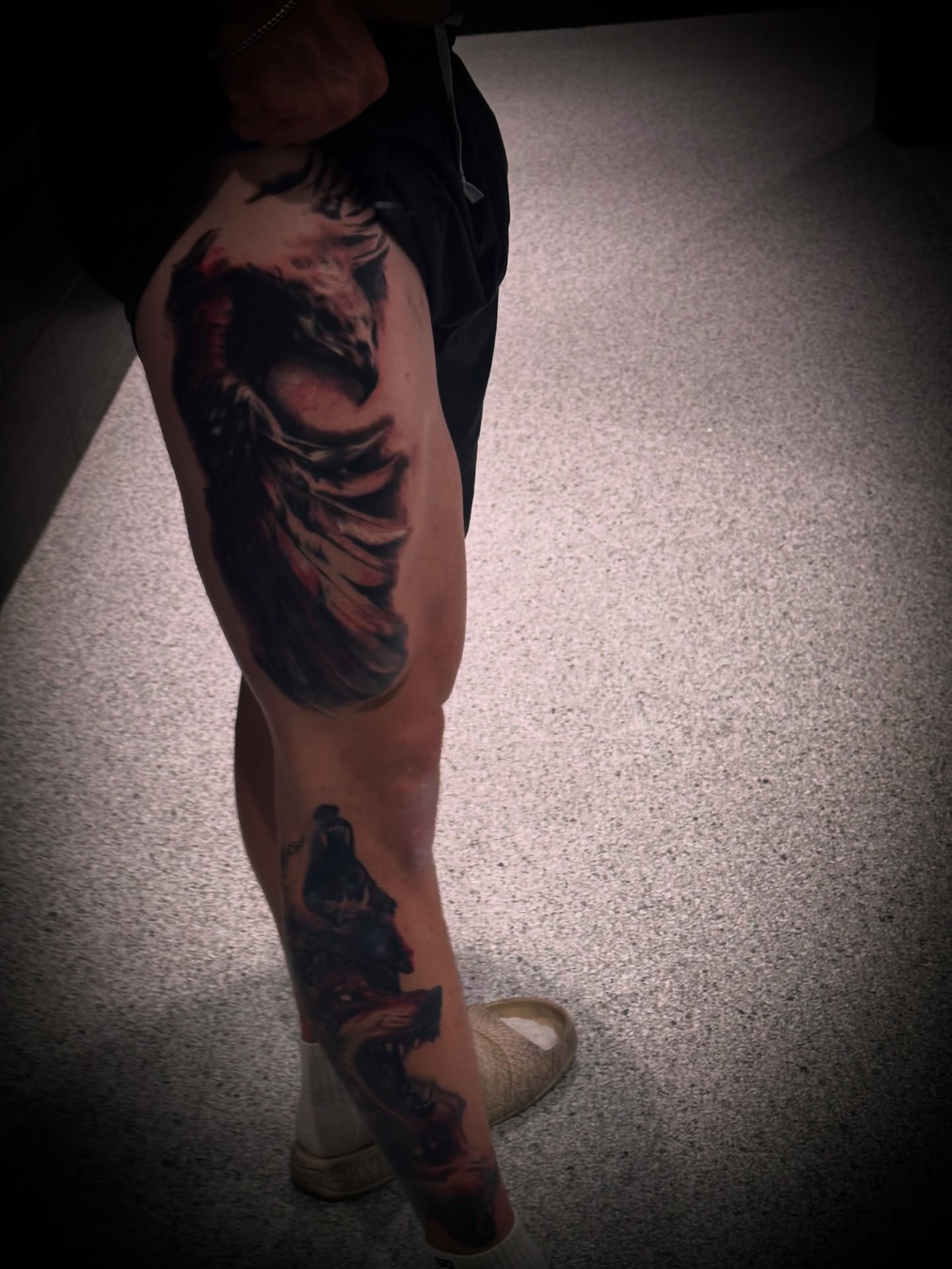 Wolf dark realism tattoo on the leg by Julian Olson