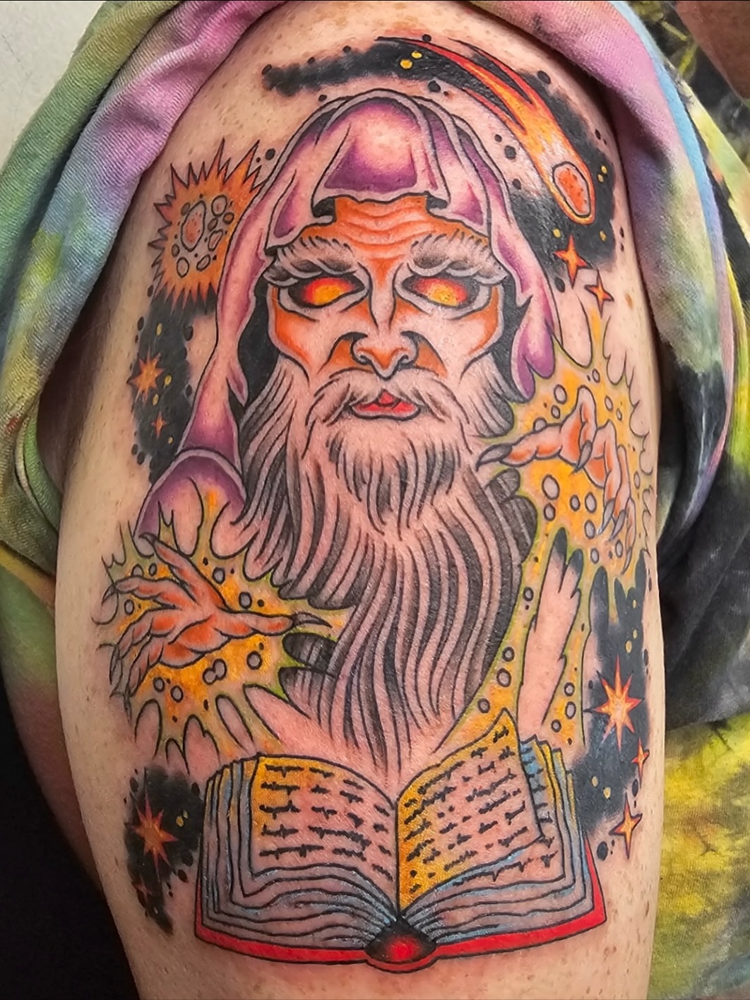 Wizard with book American traditional tattoo on the shoulder by Macy Bird