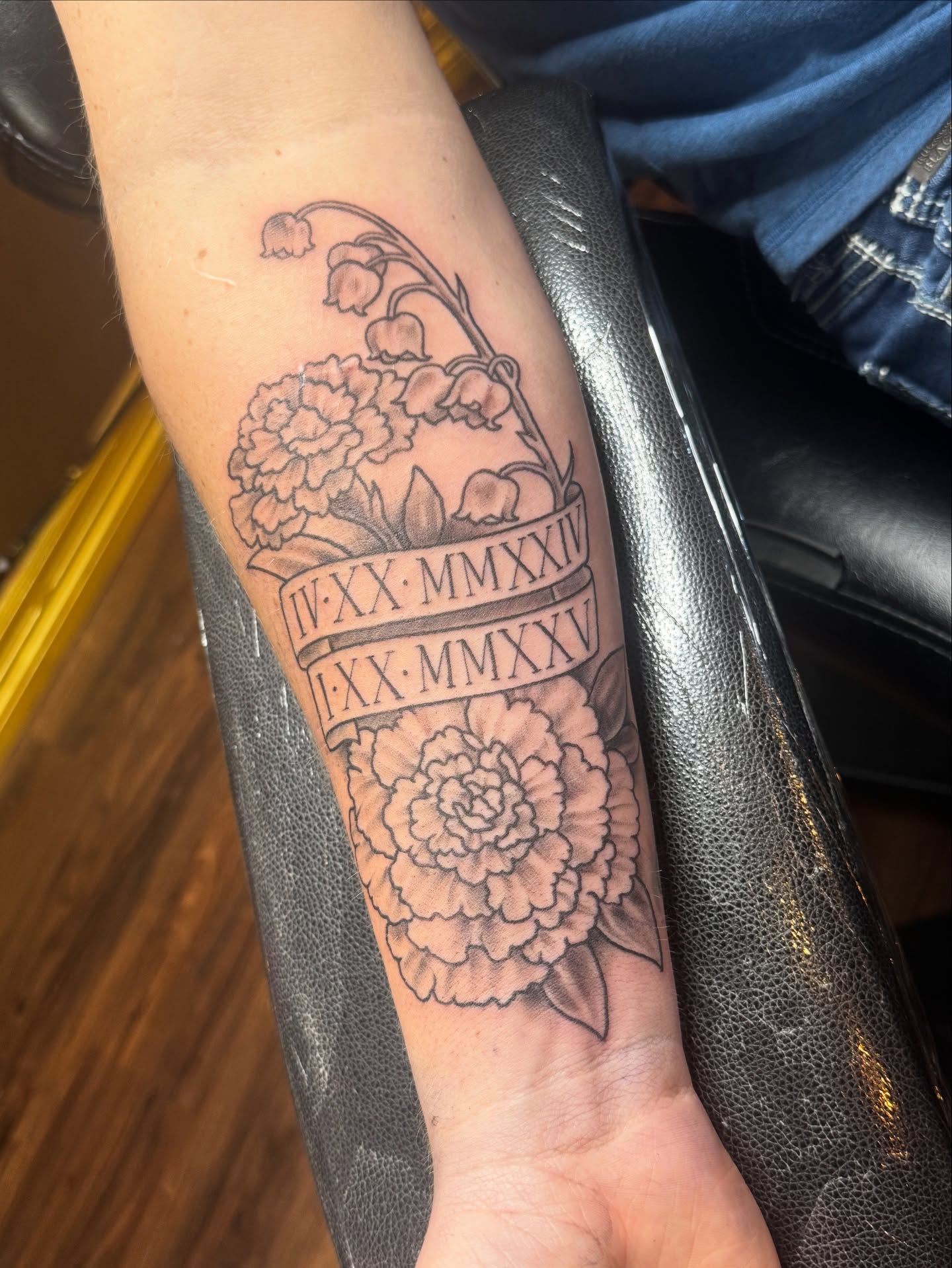 Peony and lily of the valley black and grey tattoo on the forearm by Teagan Rachel, Millcreek, Utah