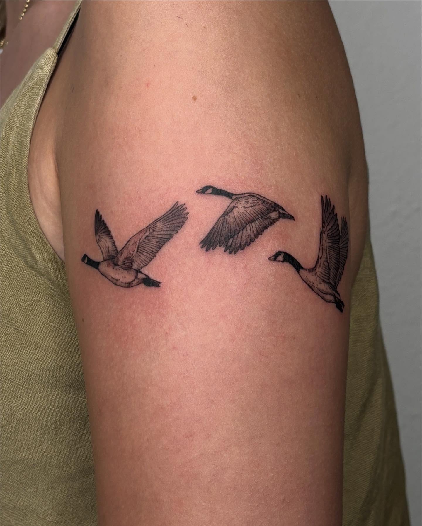 Geese black and grey tattoo on the upper arm by alyssa doing tattoos