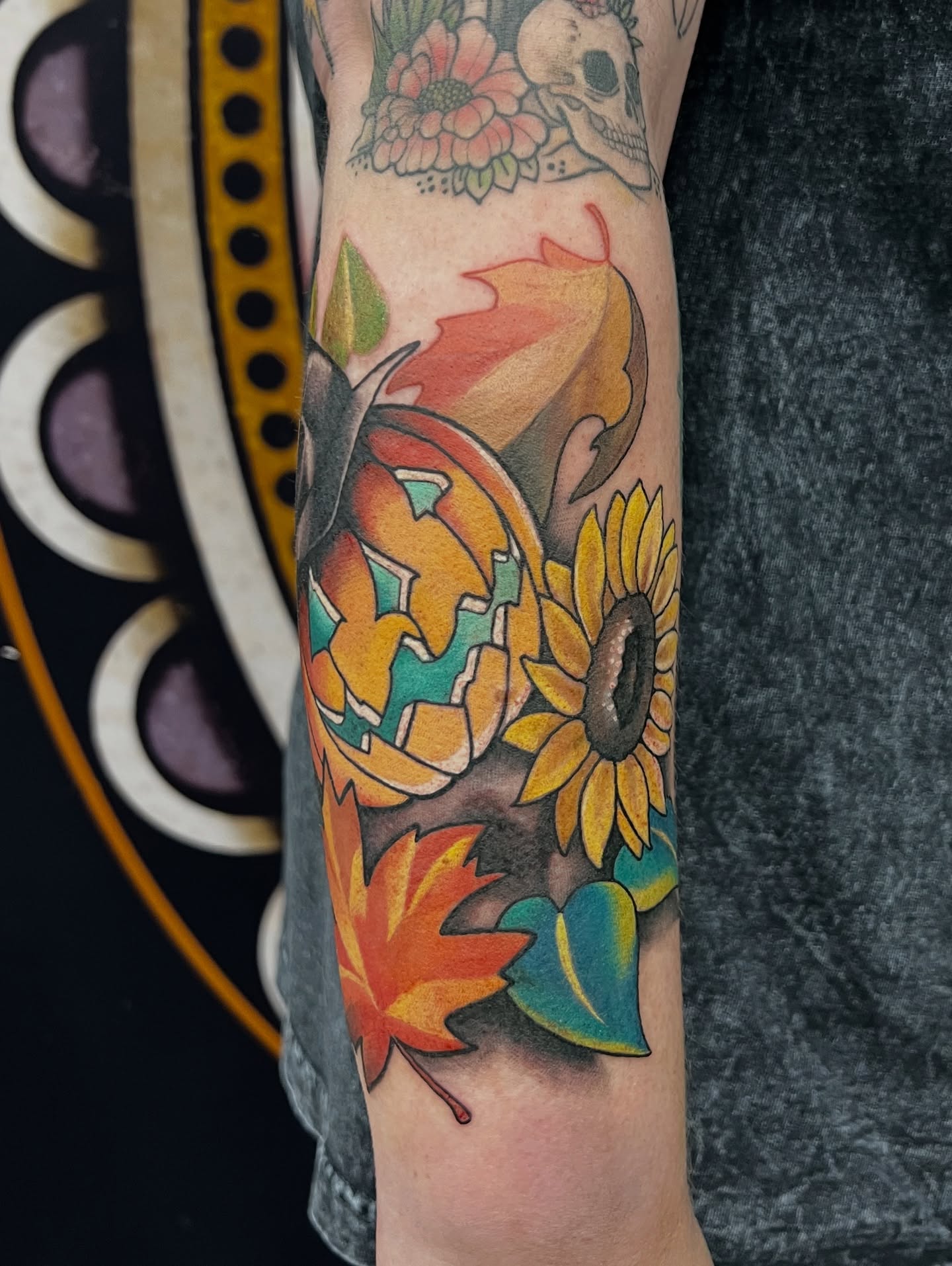 Pumpkin and sunflower American traditional tattoo on the forearm by Tattoos by Alli Wilcox