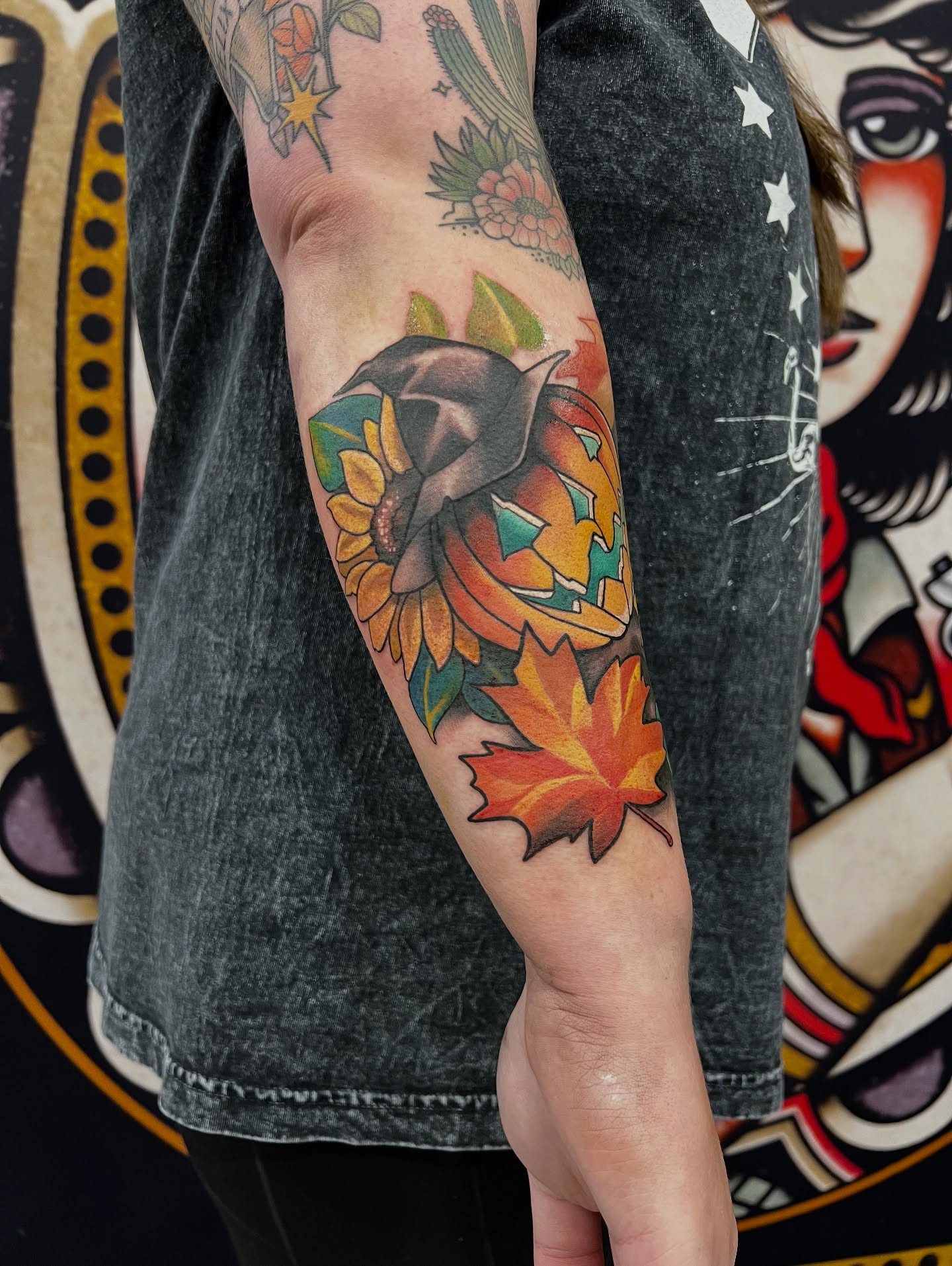 Autumn leaves and sunflower realism tattoo on the forearm by Tattoos by Alli Wilcox