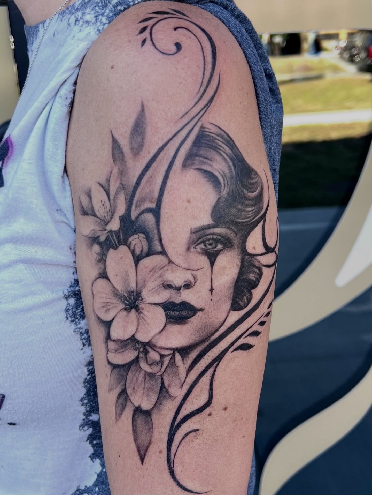 Floral portrait realism tattoo on the forearm by Tattoos by Alli Wilcox