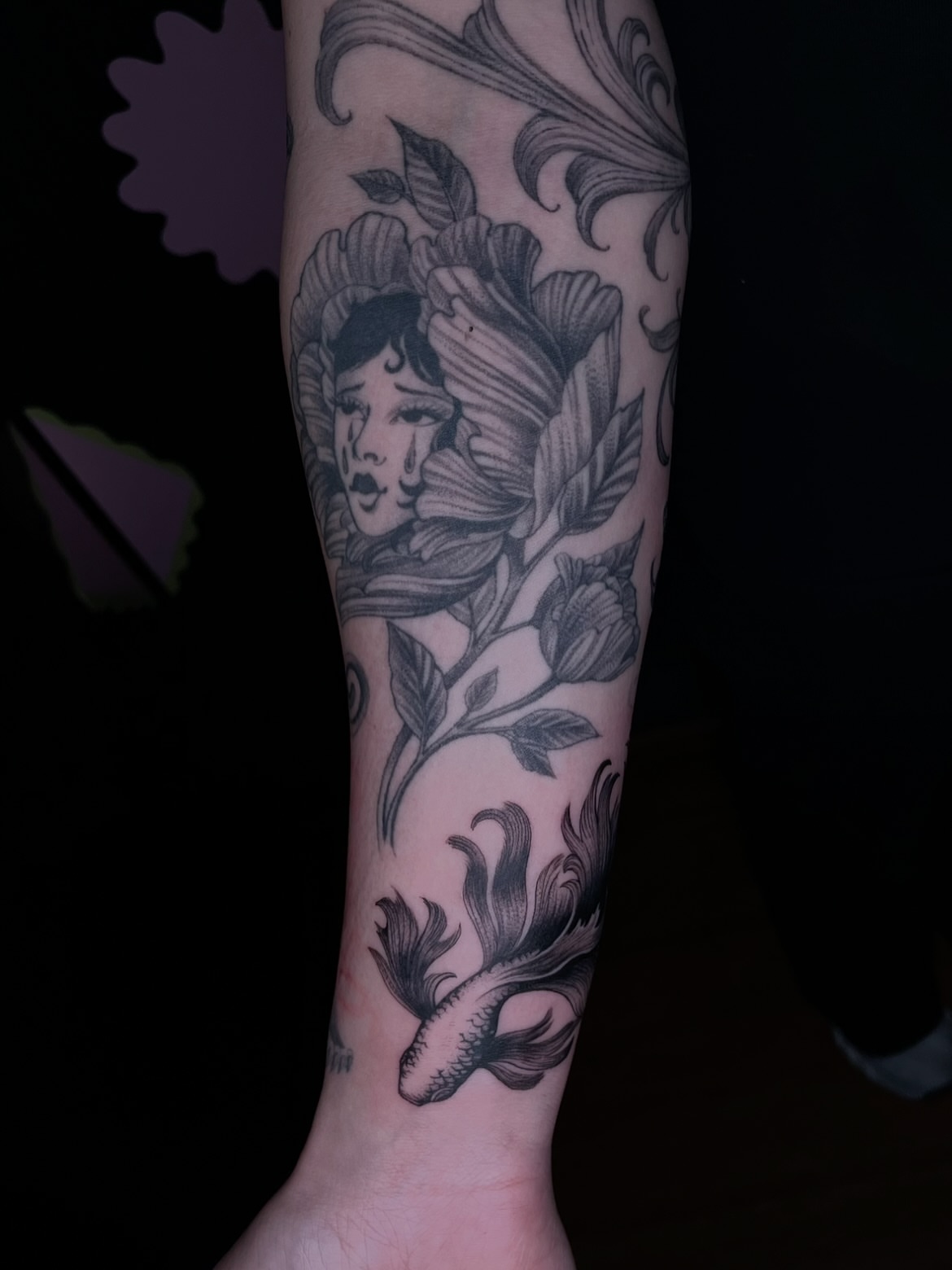 Woman with flowers realism tattoo on the forearm by Eryn, Portland, Oregon