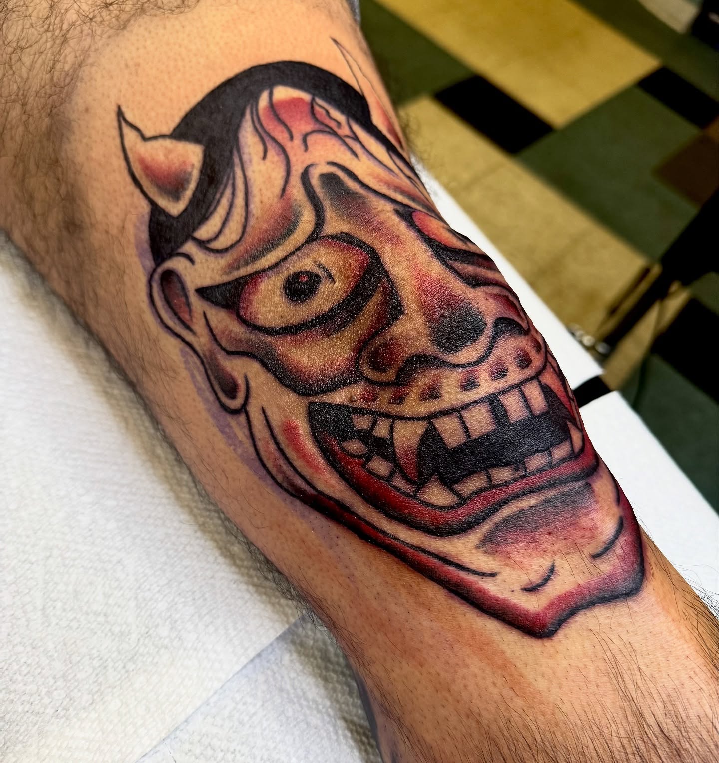 Demon mask American traditional tattoo on the forearm by Brandon