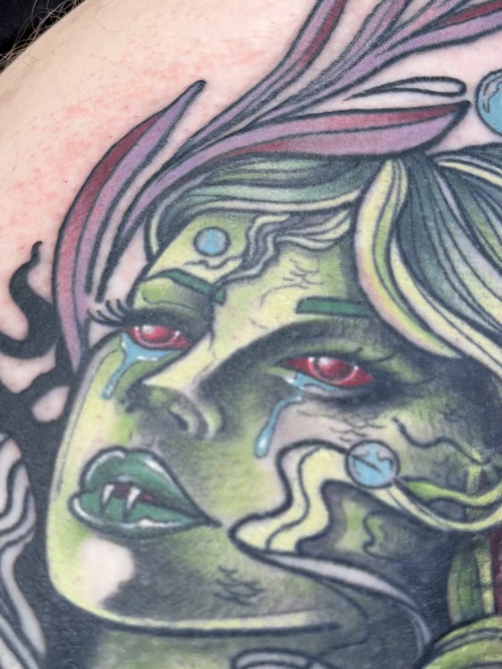 Green-skinned woman American traditional tattoo on the upper arm by Michigan Tattoo Artist - Nadia Garver, Clinton Township, Michigan