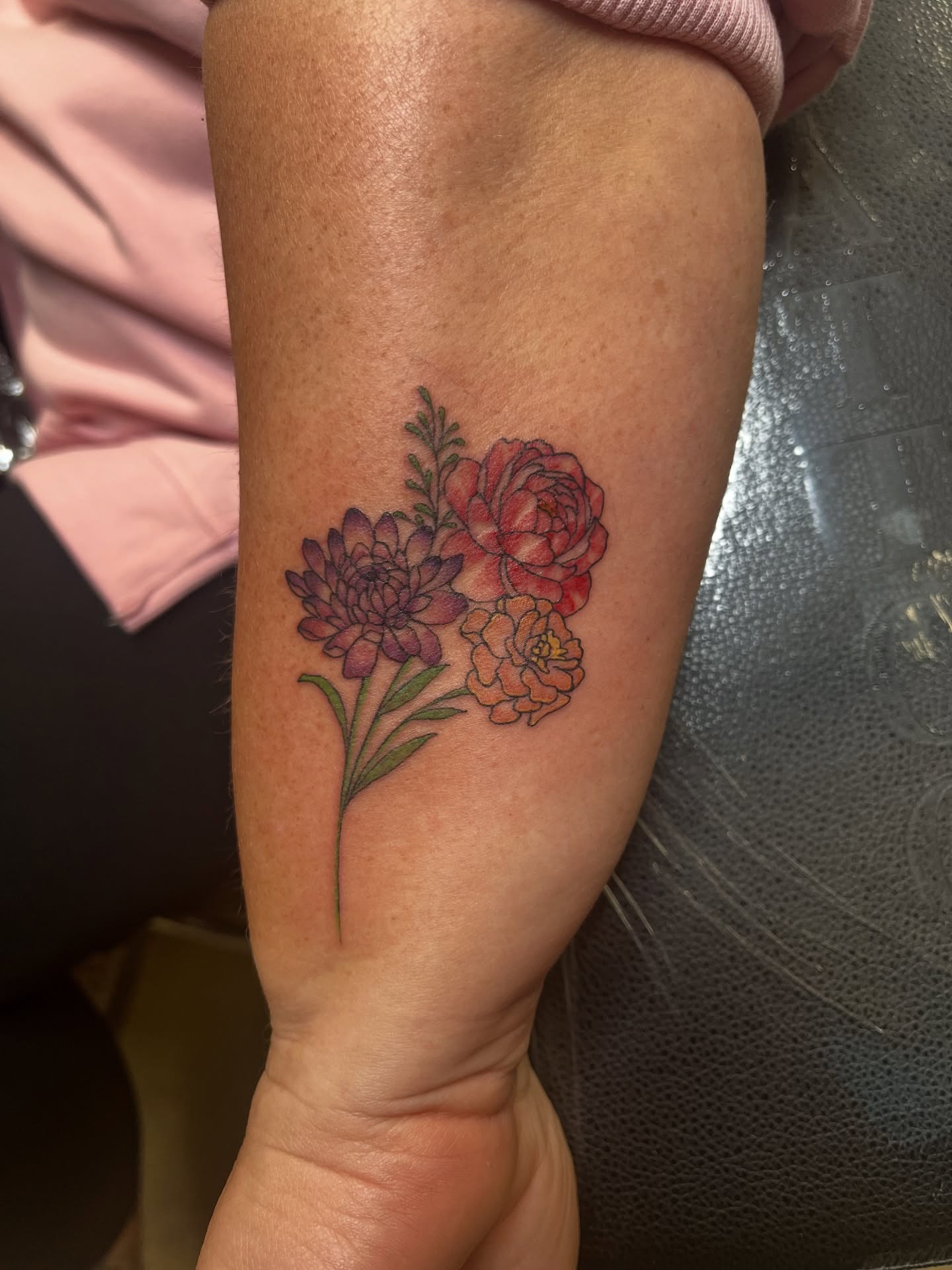 Flowers realism tattoo on the forearm by Tabitha Mathis