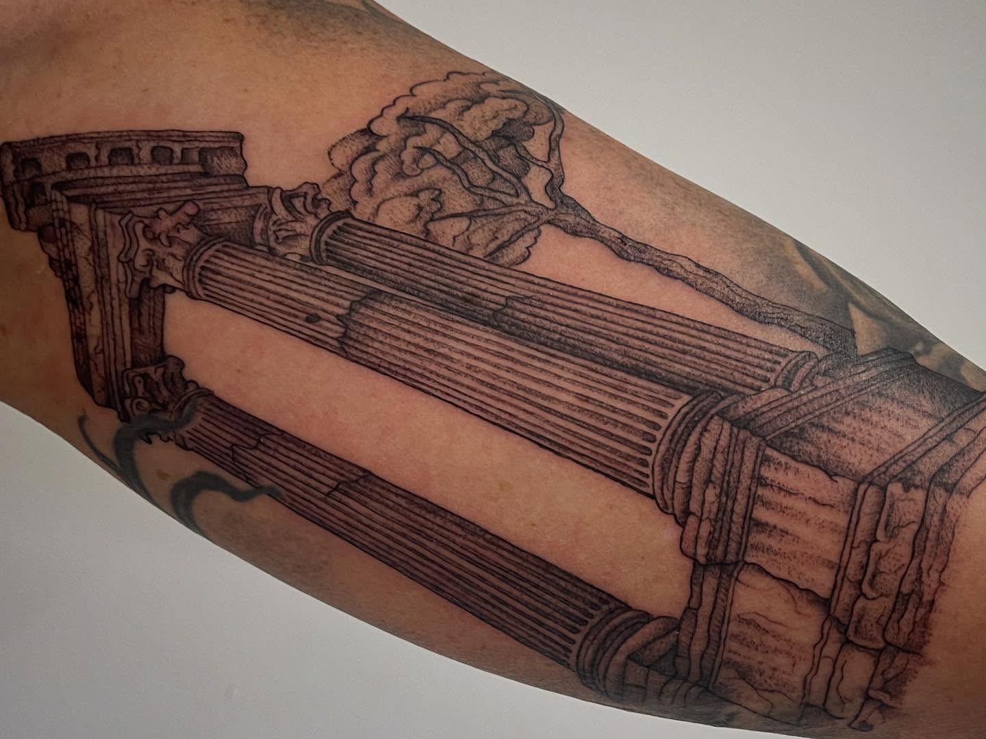 Ancient column black and grey tattoo on the forearm by Miesha Busker