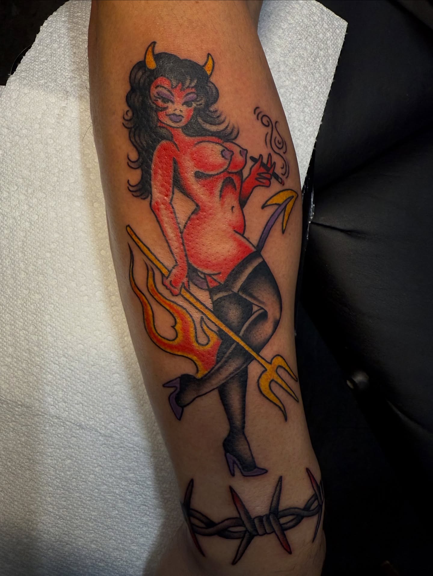 Devil pin-up girl American traditional tattoo on the forearm by Hannah Edwards, Austin, Texas