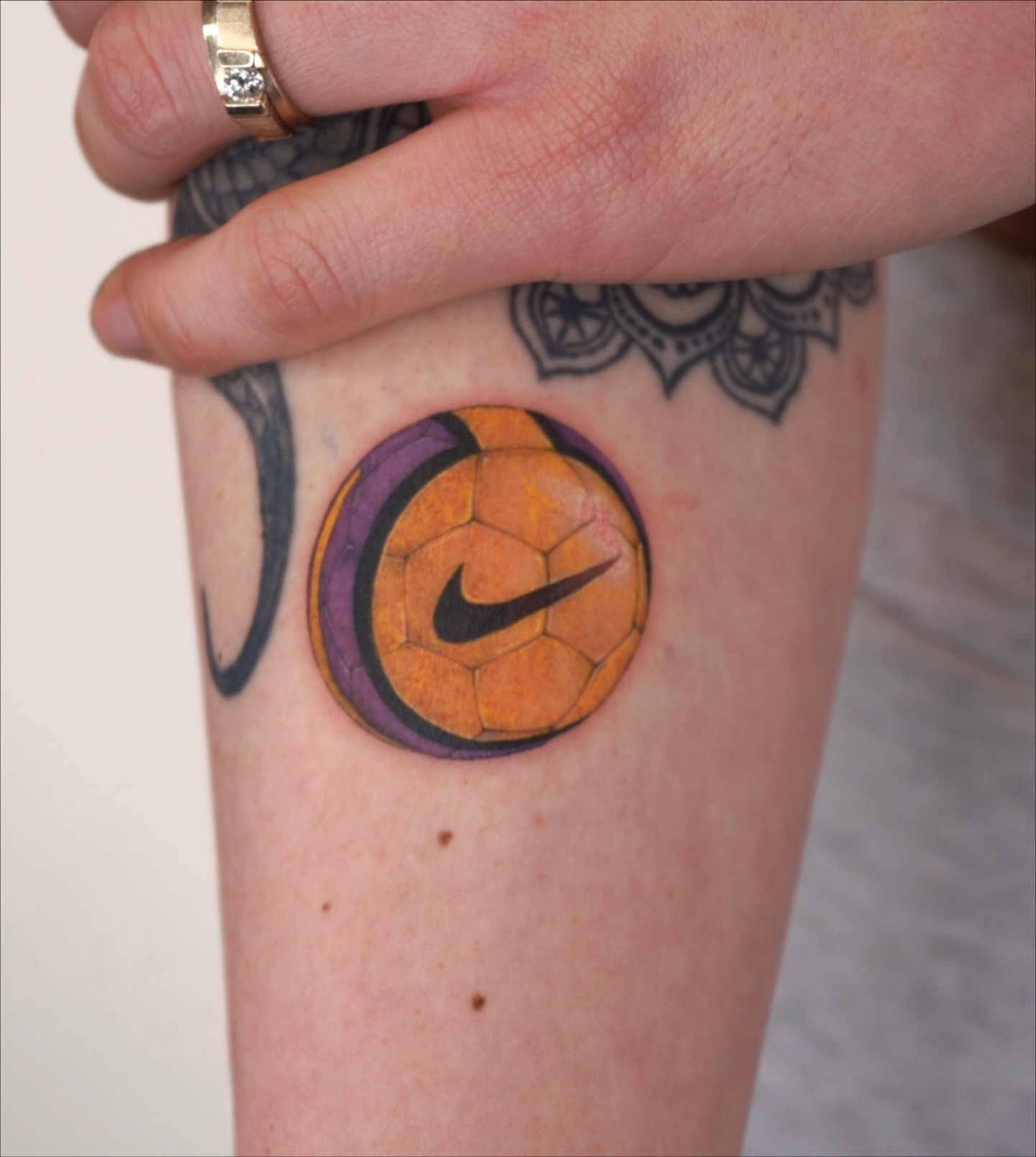 Soccer ball realism tattoo on the forearm by Sun Child Tattoo 🌻