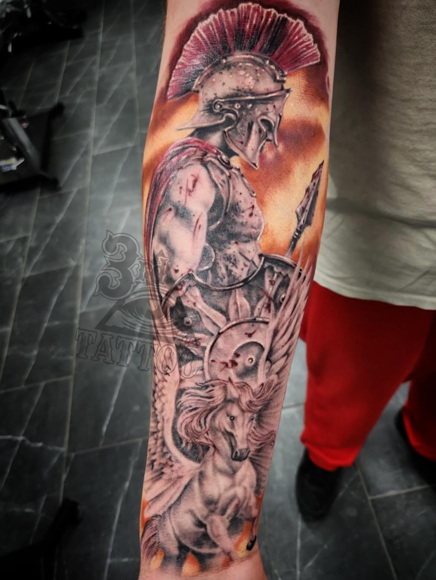 Spartan warrior and winged horse realism tattoo on the forearm by 3rd Eye Tattoo and Art Gallery