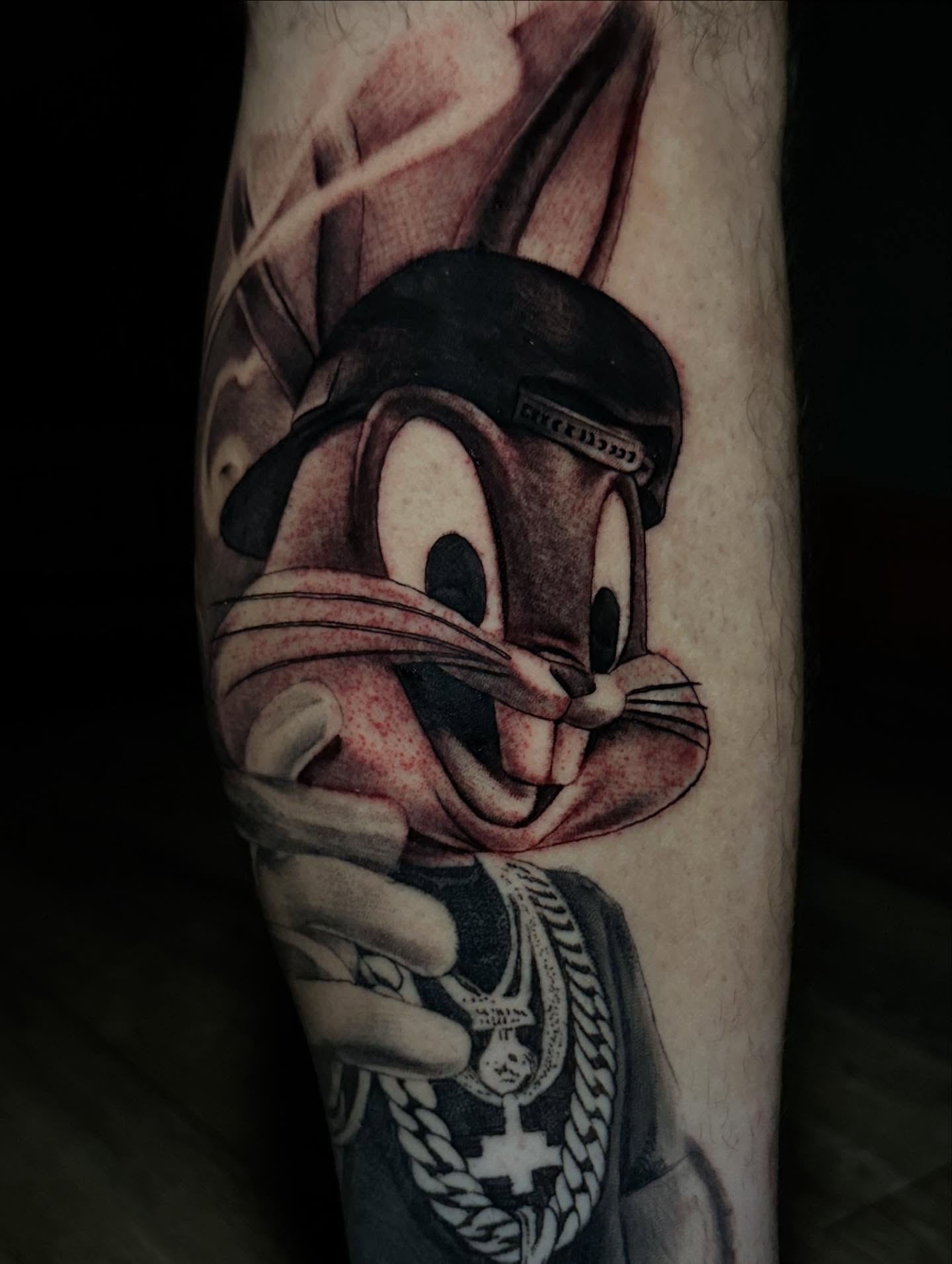 Looney tunes character realism tattoo on the forearm by "CAM", West Palm Beach, Florida