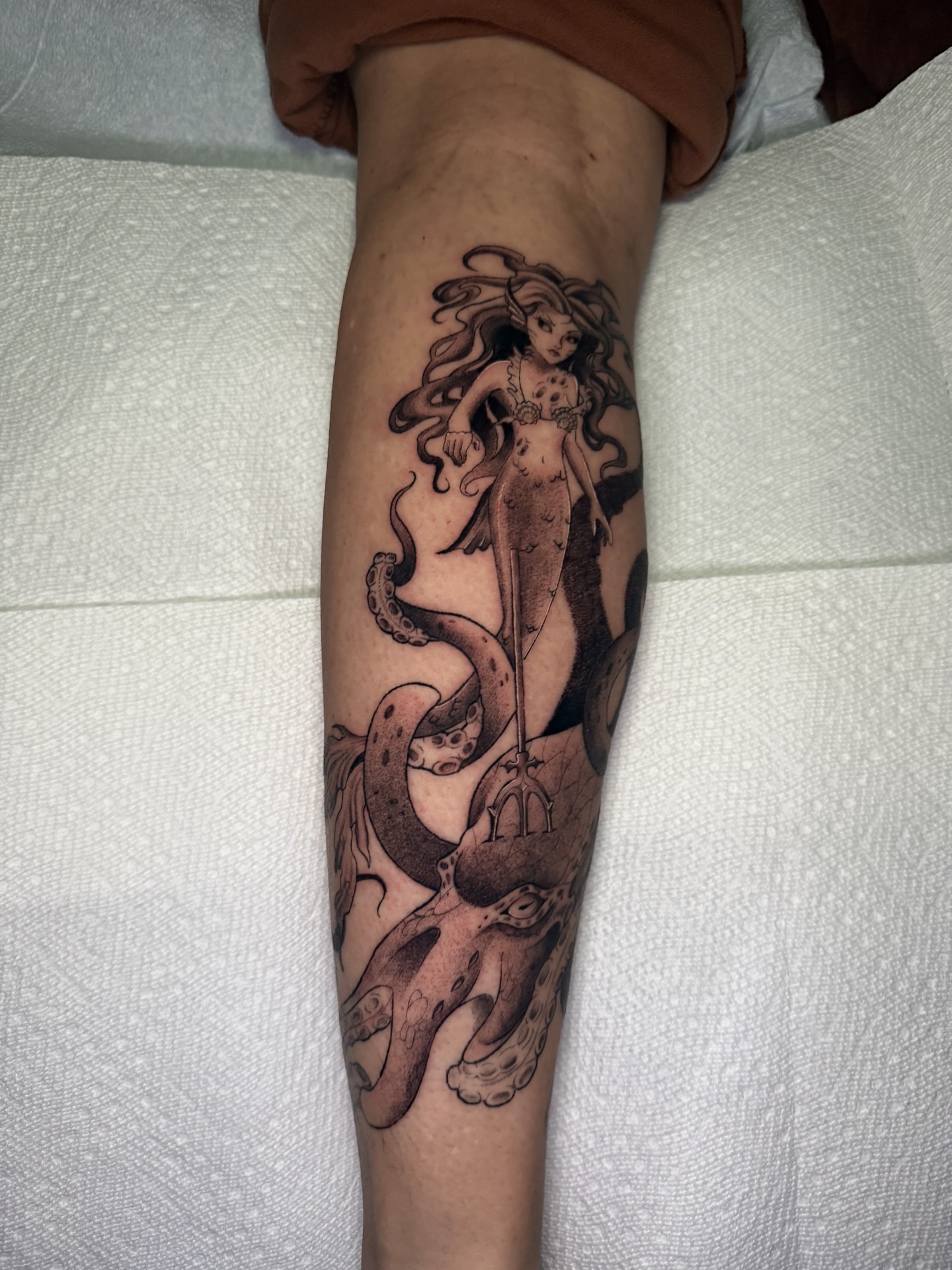 Mermaid and octopus black and grey tattoo on the forearm by 𝕹𝖆𝖙