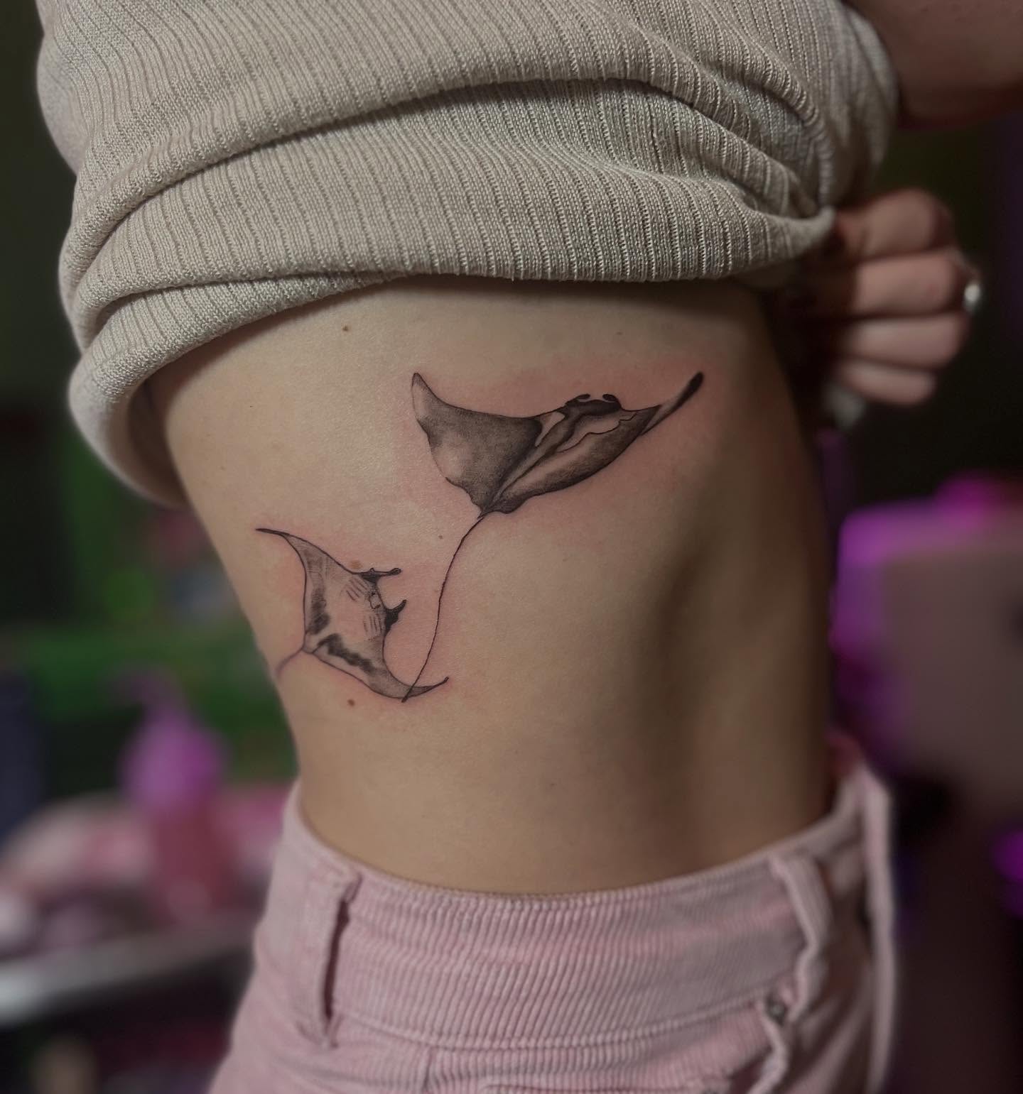Manta rays black and grey tattoo on the ribs by Caitlin, Richmond, Virginia