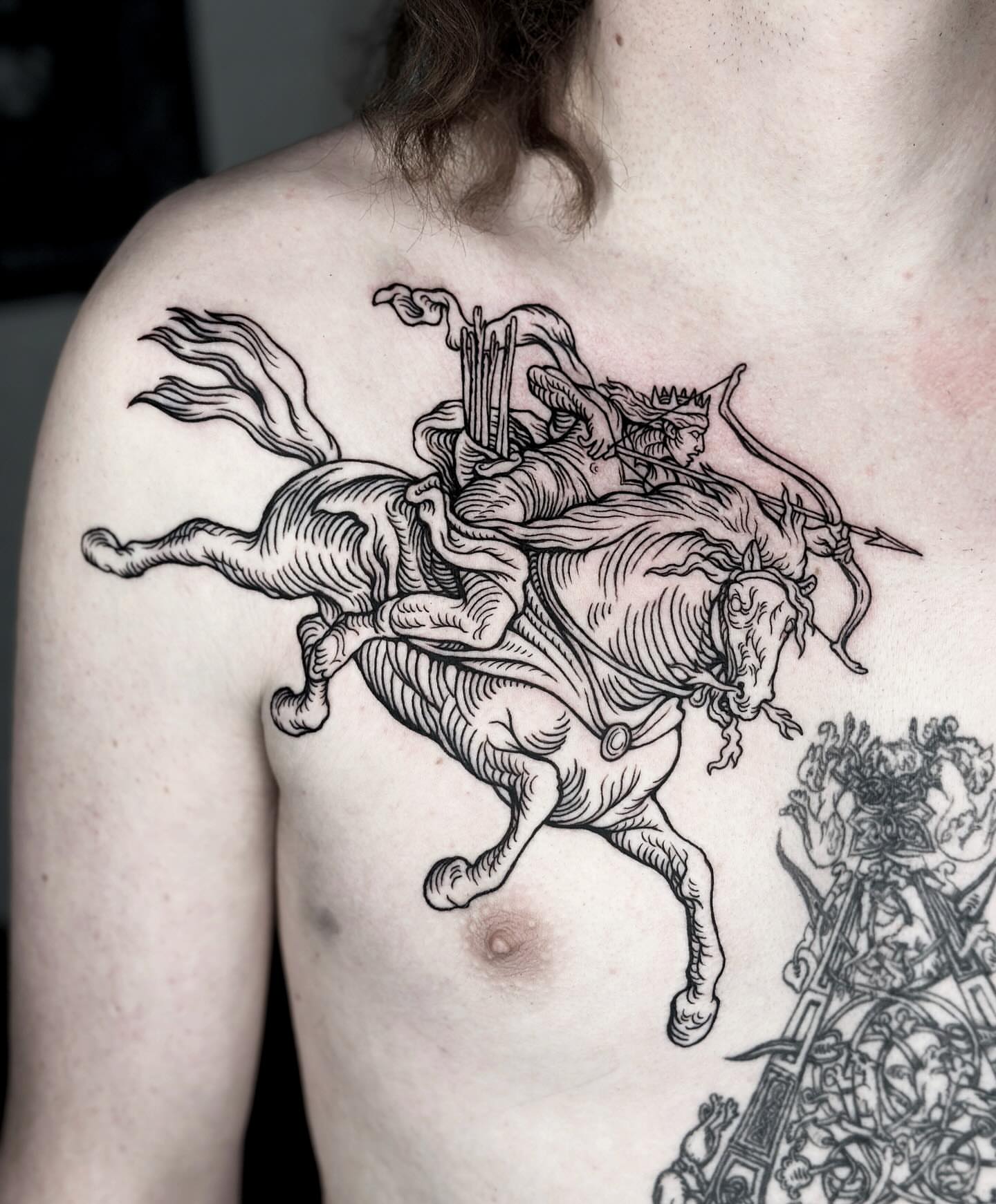 Horseman on horseback black and grey tattoo on the chest by 𝕾𝖆𝖘𝖍𝖆 𝖂𝖔𝖑𝖆𝖓𝖉