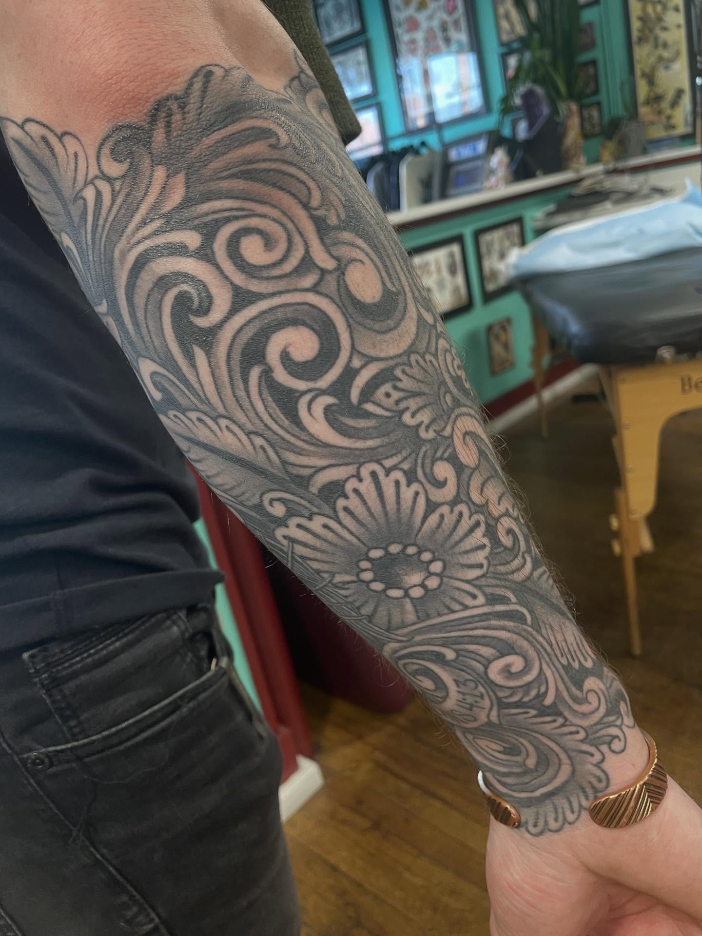 Floral ornament ornamental tattoo on the forearm by Haley McMahon