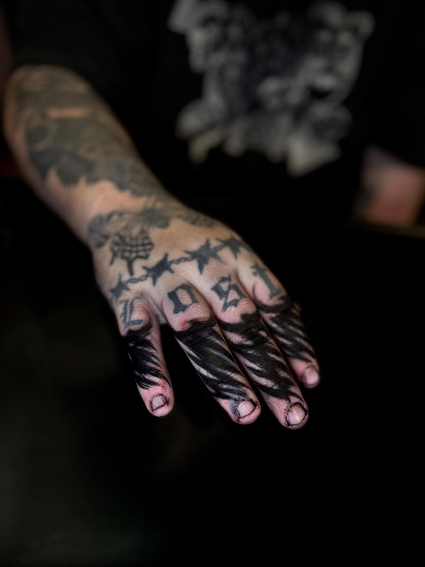 Stars and numbers black and grey tattoo on the hand by Thomas Martinez