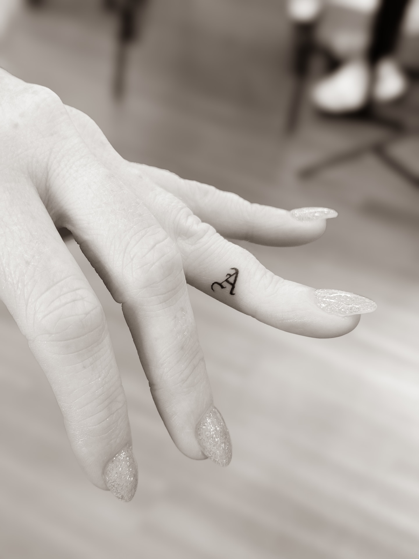 Letter 'A' lettering script tattoo on the hand by Yuli Noama