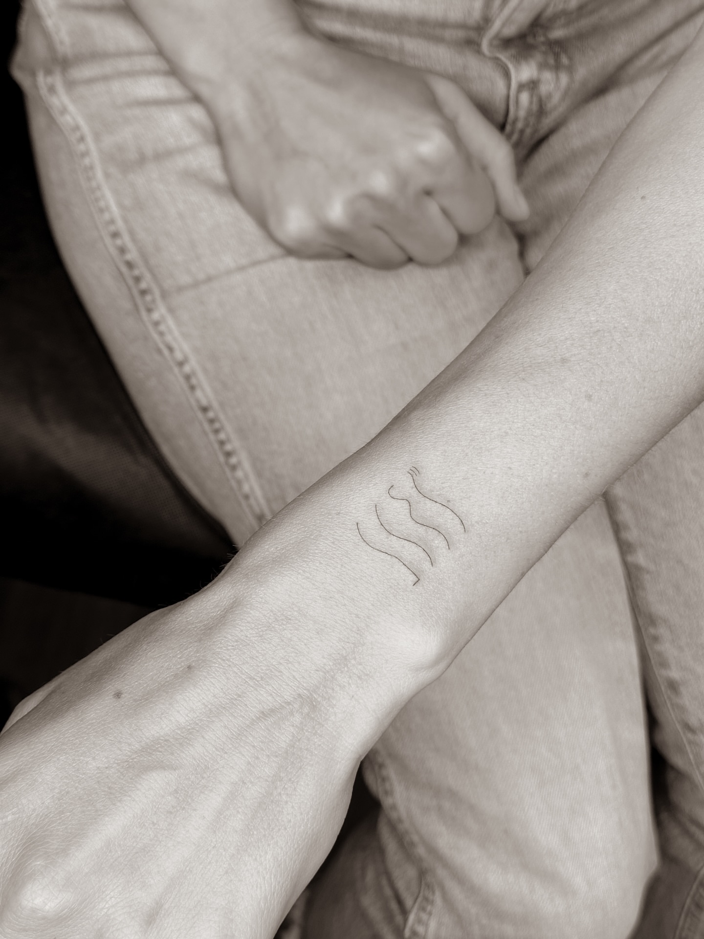 Water symbol black and grey tattoo on the forearm by Yuli Noama