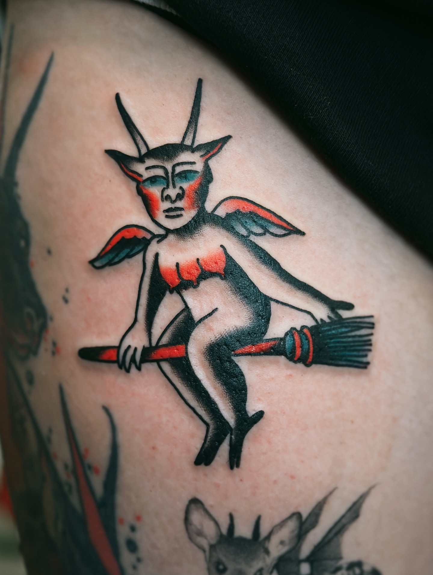 Devil riding broom American traditional tattoo on the thigh by Holly Ellis, San Francisco, California