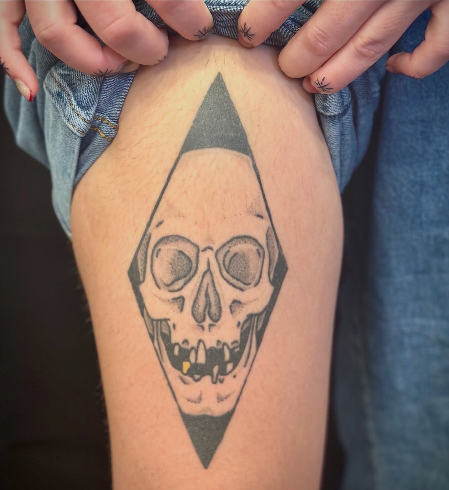 Skull geometric tattoo on the thigh by Maddie Morrill
