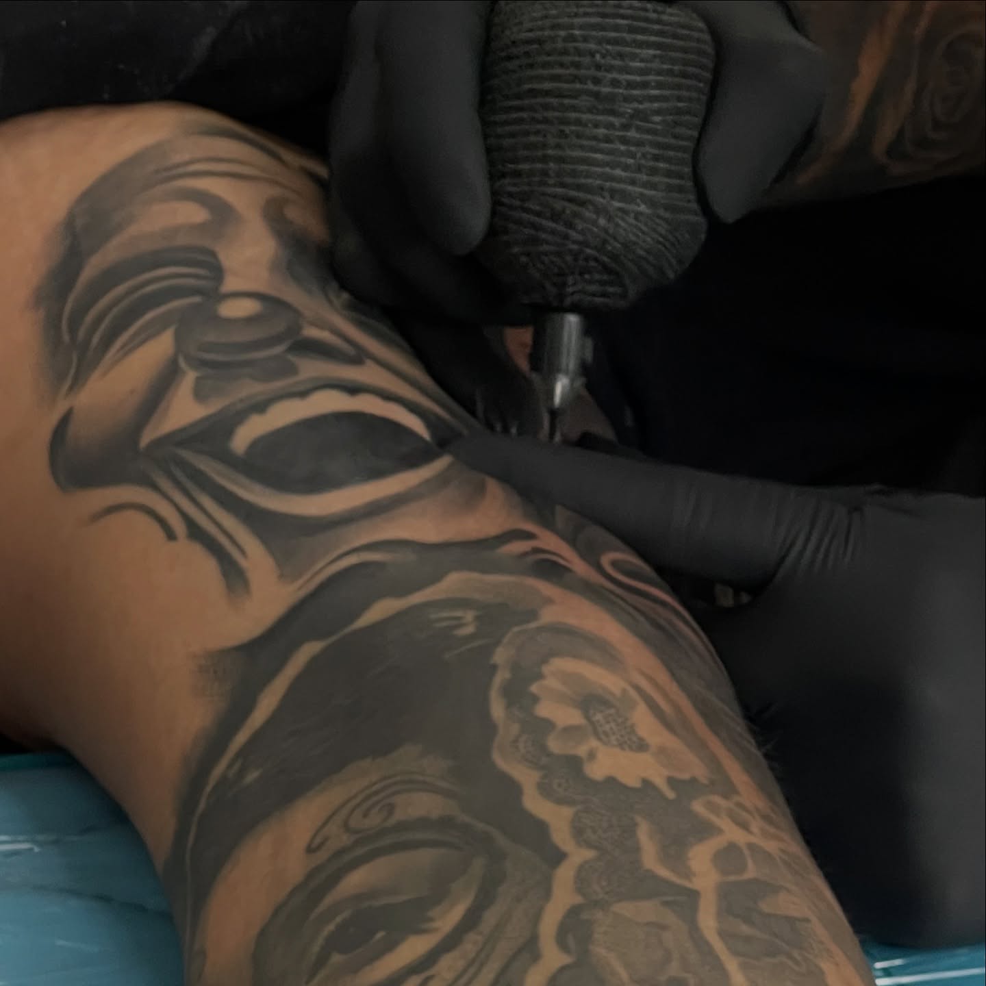 Mask tribal tattoo on the upper arm by Bigtoons21