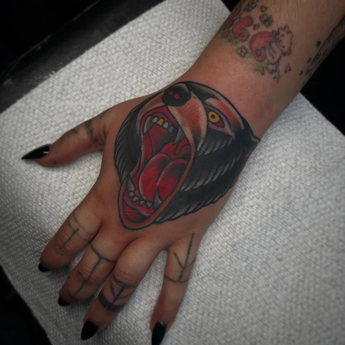 Roaring bear American traditional tattoo on the hand by Beejay Tattoo Artist San Antonio Amarillo TX