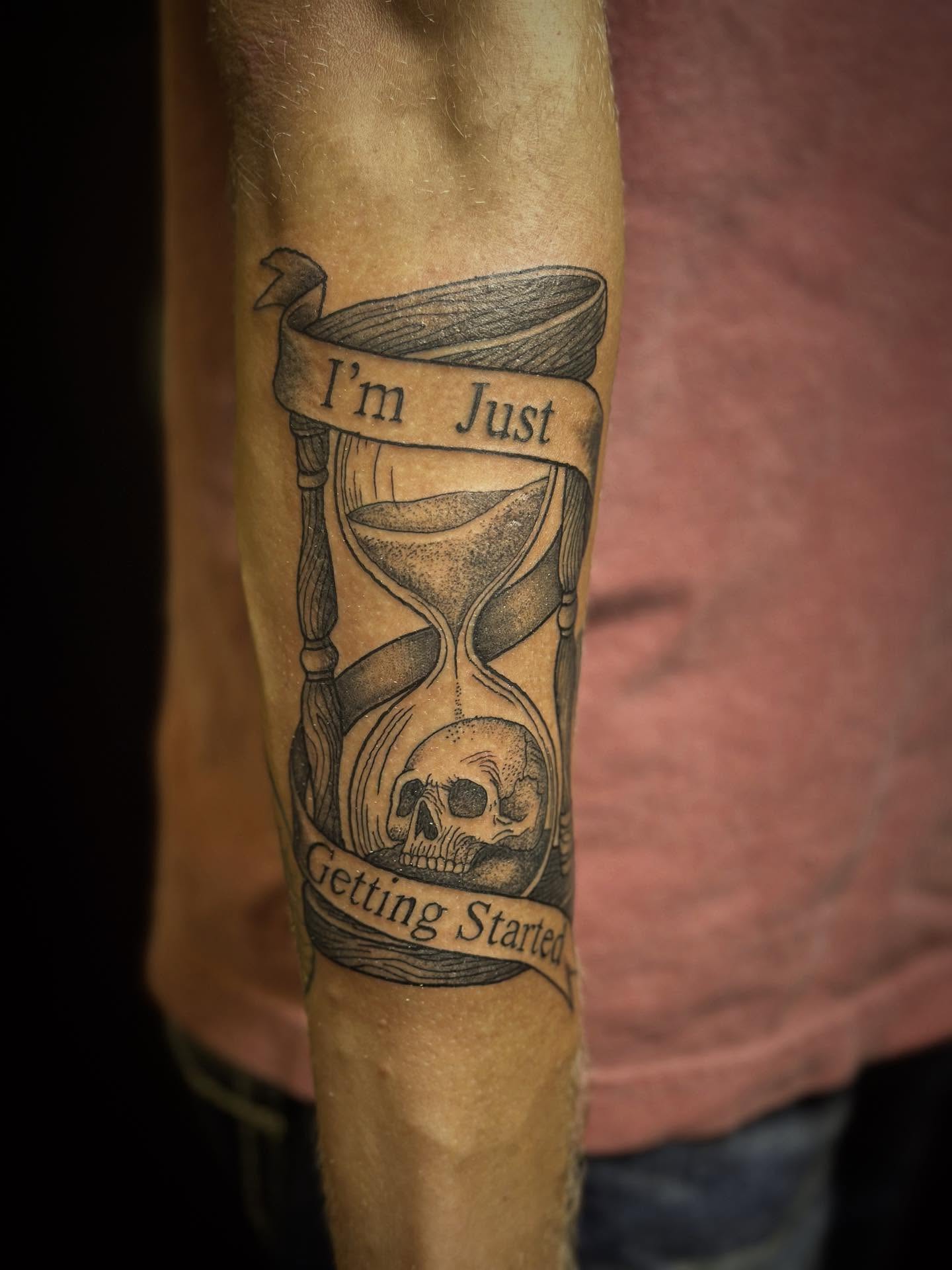 Hourglass and skull black and grey tattoo on the forearm by Joshua Ware, Alvarado, Texas