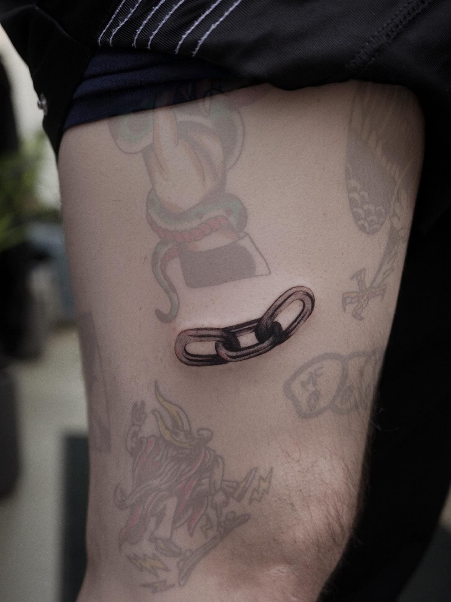 Chain and padlock American traditional tattoo on the thigh by It’s ya girl, KB