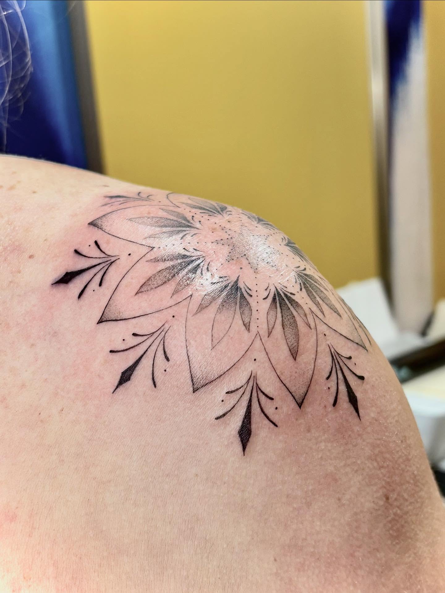 Floral design black and grey tattoo on the shoulder by Jazzlyn Hous