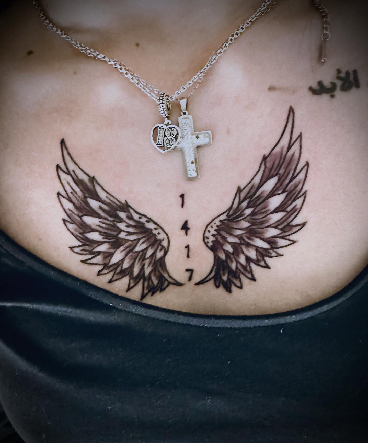 Wings black and grey tattoo on the chest by Salvador Mendoza, Sesto San Giovanni