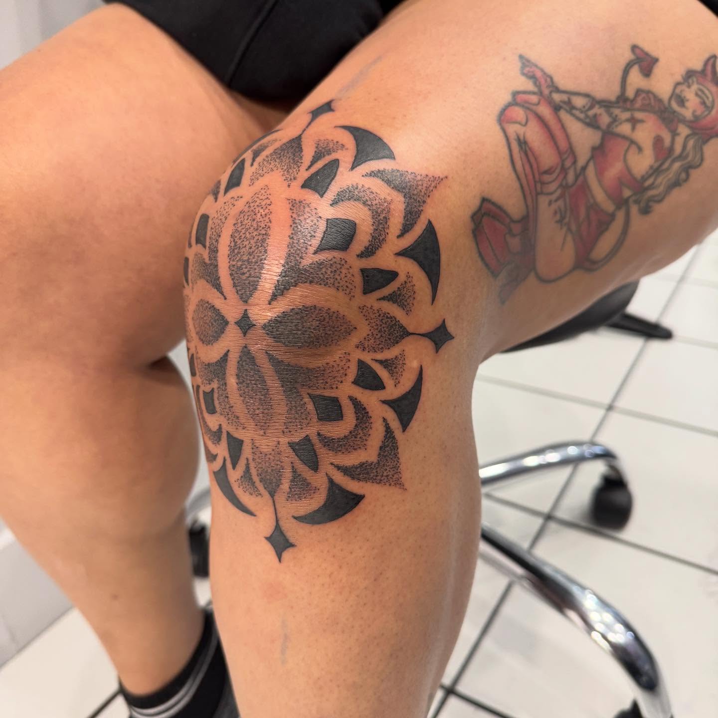 Geometric mandala dotwork tattoo on the thigh by Ashley Rose - Minnesota Tattoo Artist