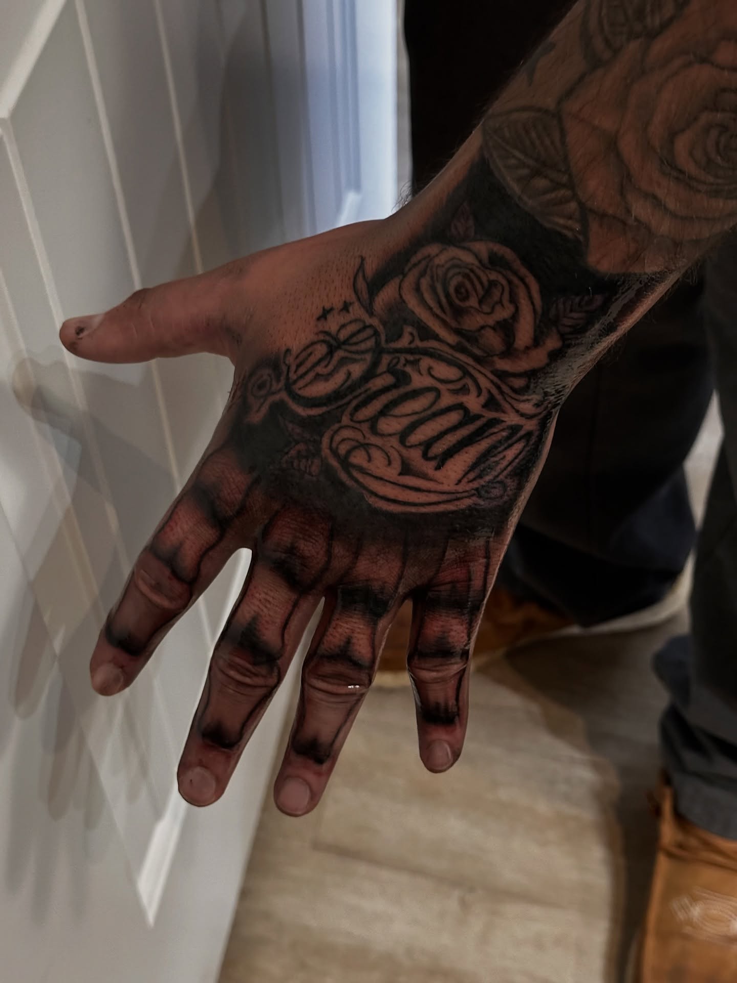 Rose and script black and grey tattoo on the hand by Ink’d by Reina 🖤, Colorado Springs, Colorado