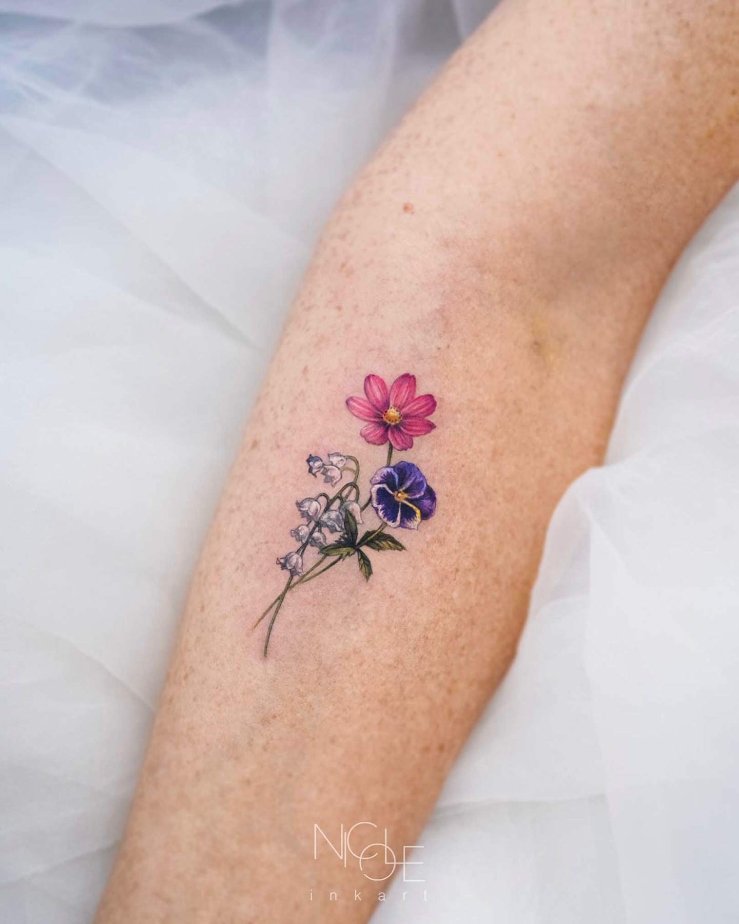 Flowers watercolor tattoo on the forearm by 𝐍𝐈𝐂𝐎𝐋𝐄 𝐋