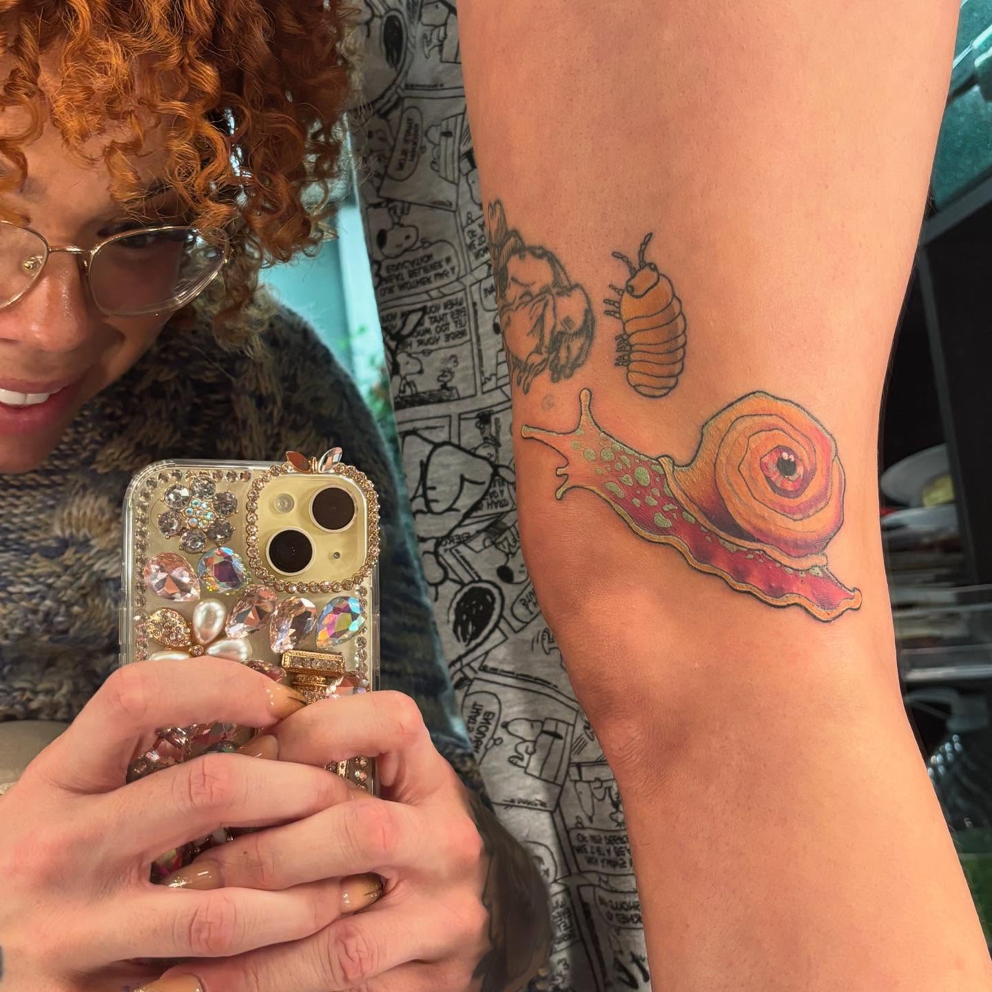 Snail realism tattoo on the forearm by Rachel Foster